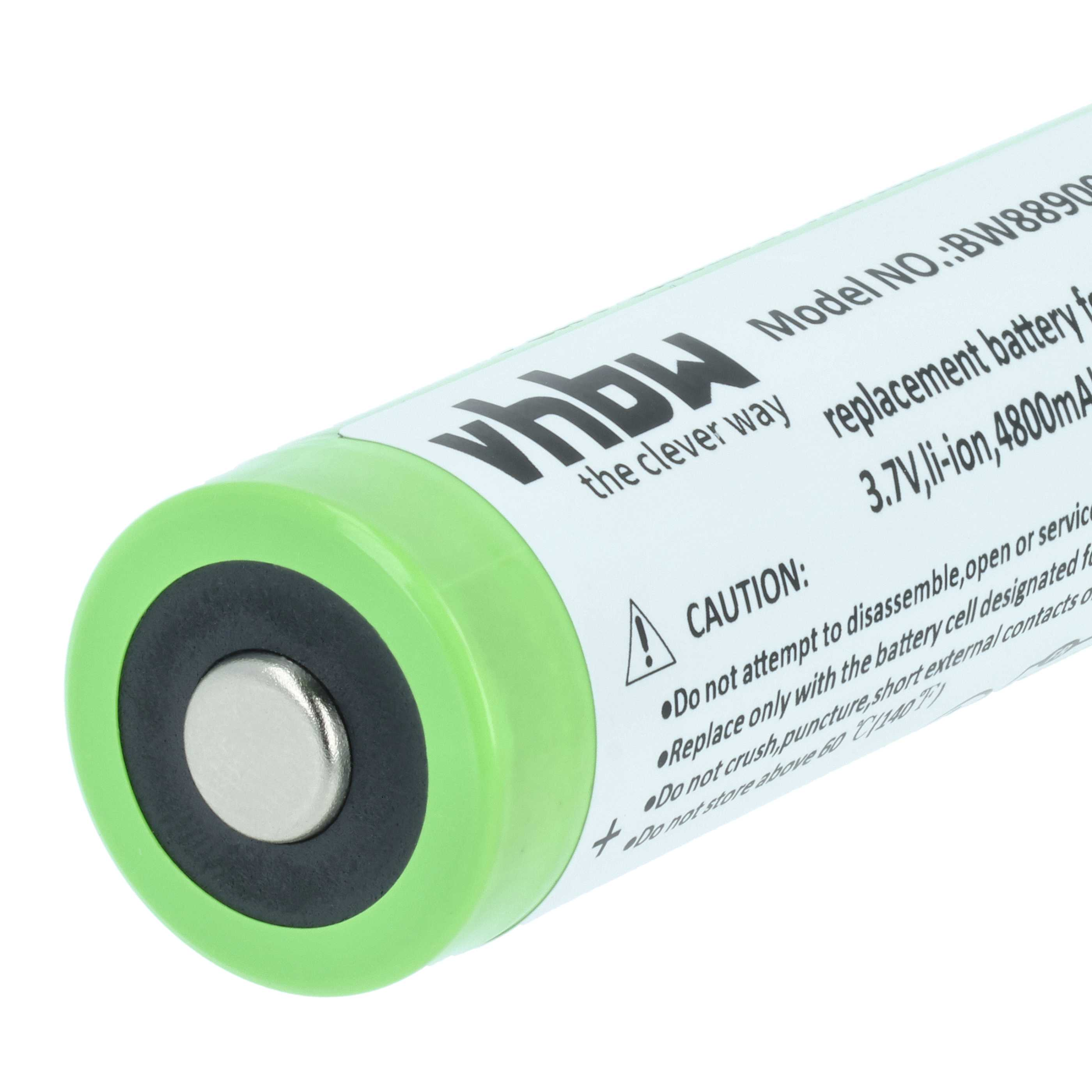 Grüne Batterie mit silbernem Pluspol und Warnhinweisen.