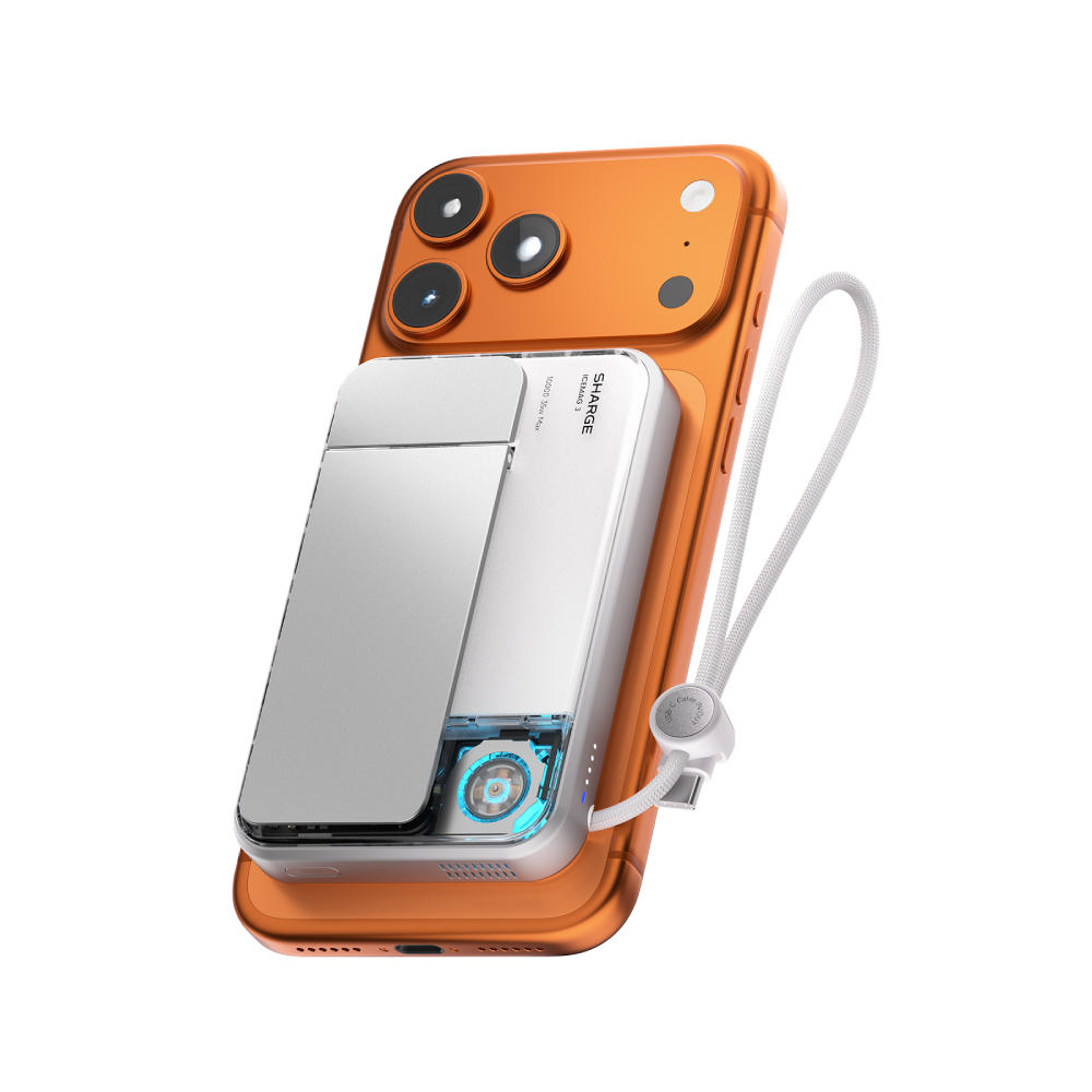 Un smartphone orange avec une batterie externe blanche attachée, lanière blanche.