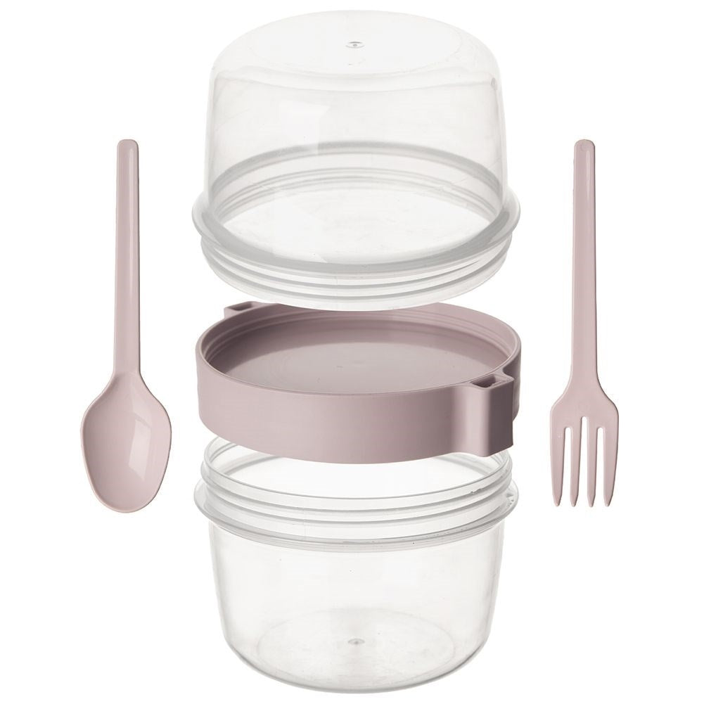 Un recipiente transparente con cuchara y tenedor rosas, desmontado.