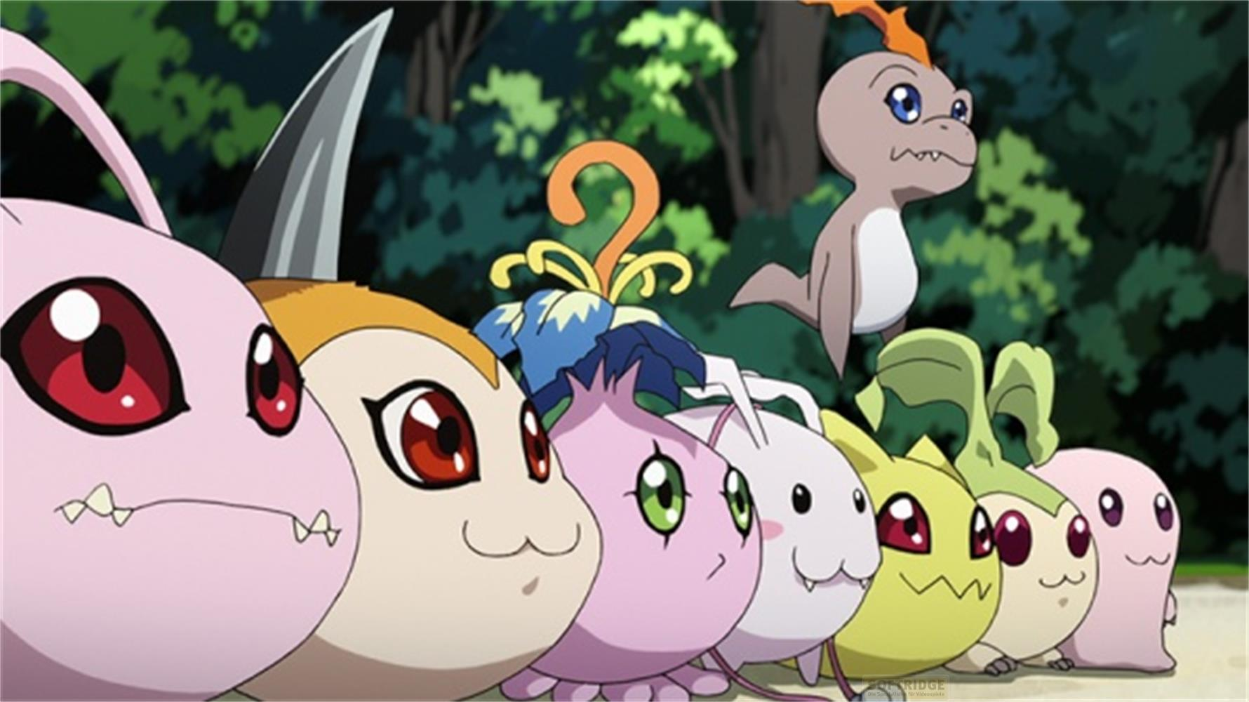 Un gruppo di Digimon in una foresta, alcuni davanti, uno sullo sfondo.