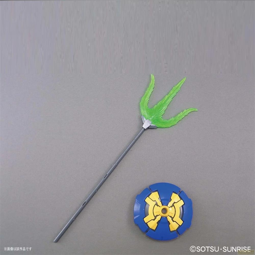Une lance à rayons verte et un bouclier bleu et jaune sur fond gris.
