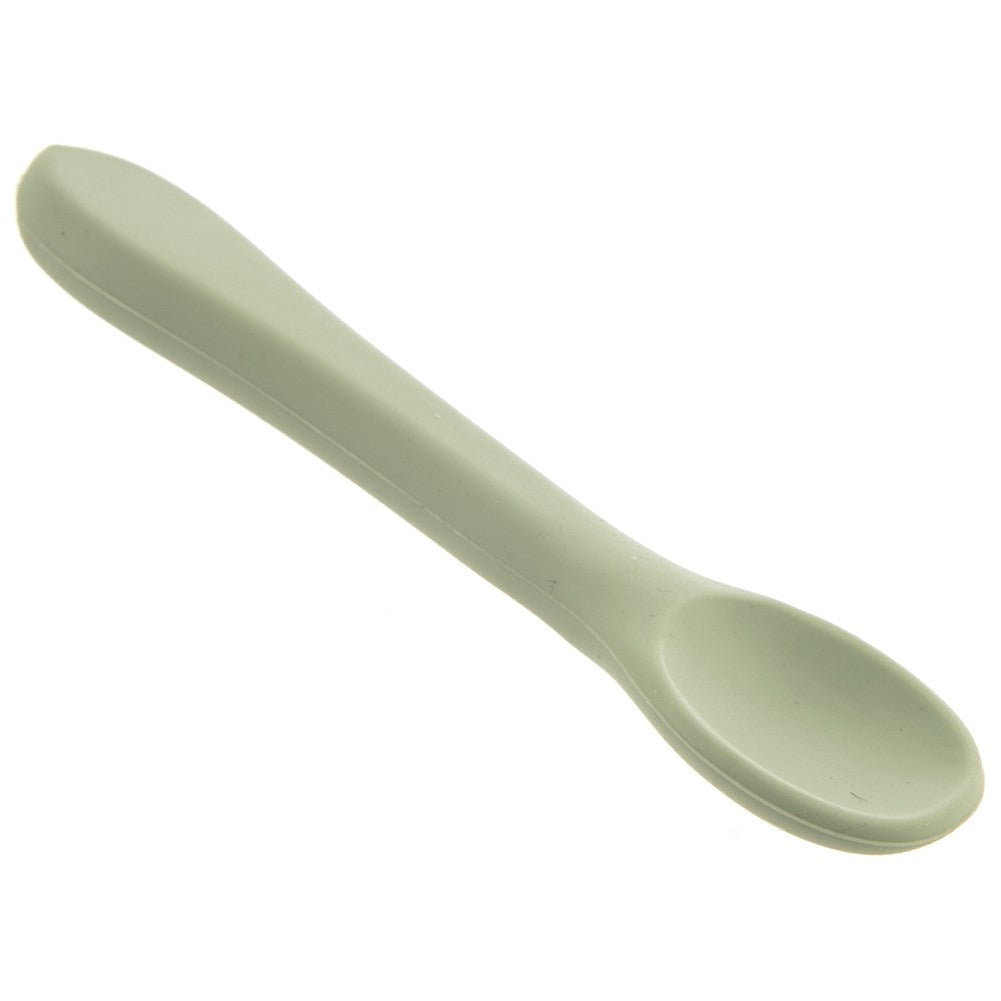Una cuchara verde claro sobre fondo blanco.