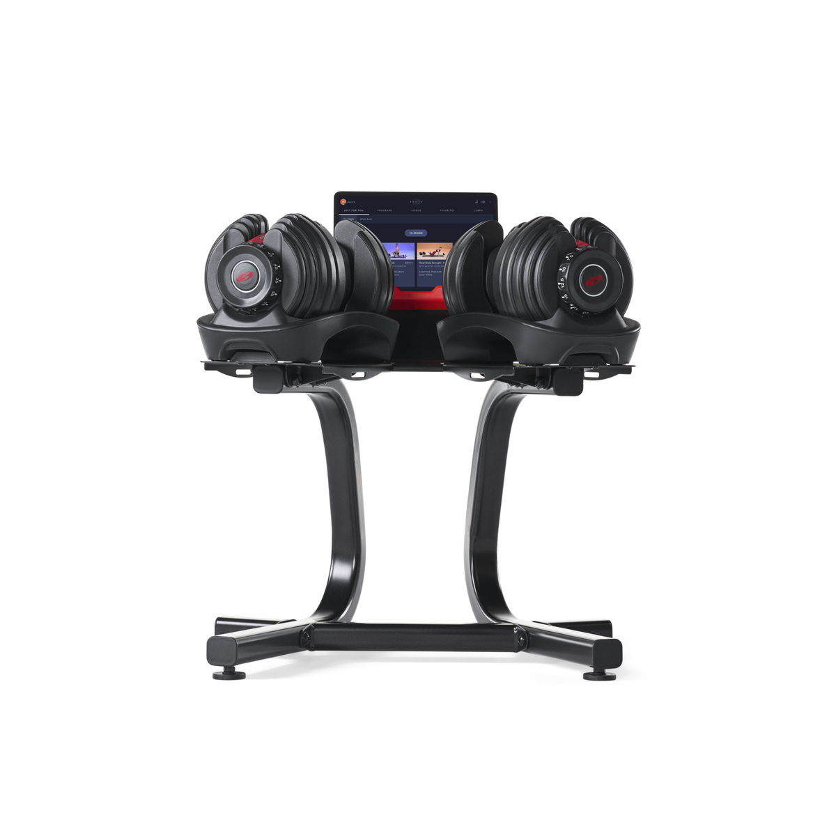 Verstelbare dumbbells op een standaard met tabletscherm.