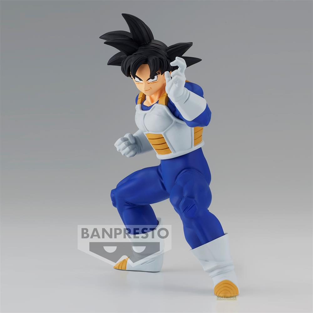 Una figura de Goku con ropa azul y armadura blanca, en pose de lucha.