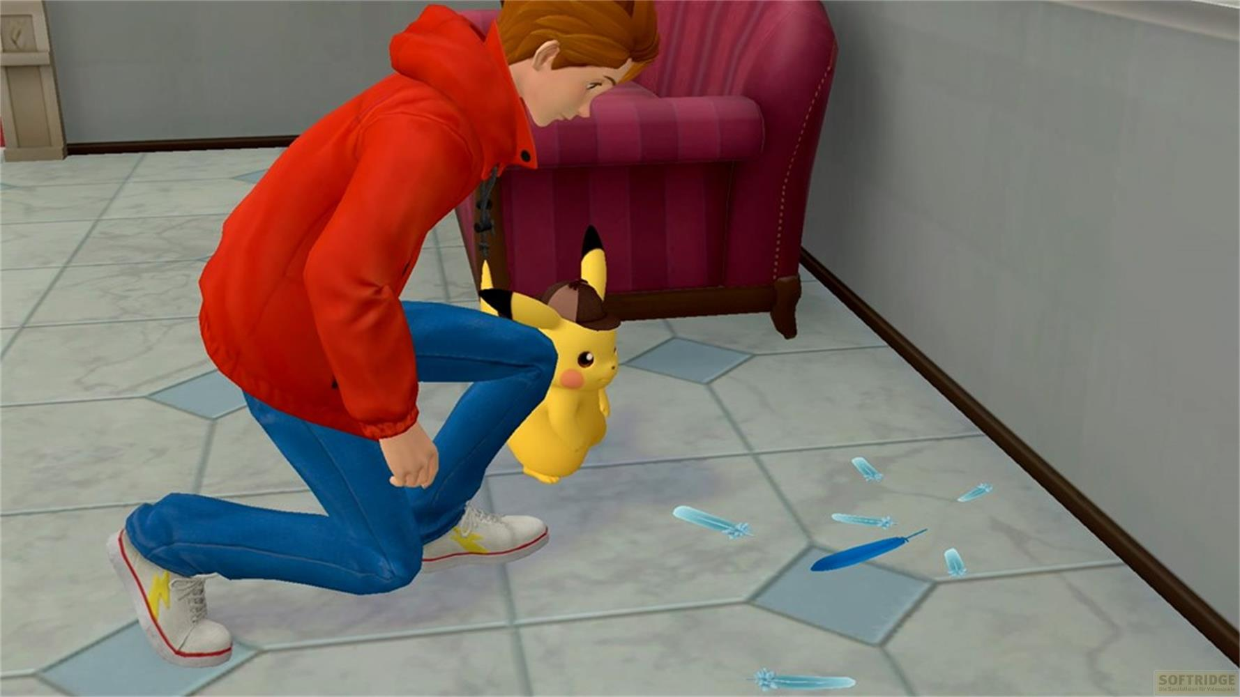 Un ragazzo in rosso e blu si inginocchia accanto a Pikachu, guardando piume a terra.