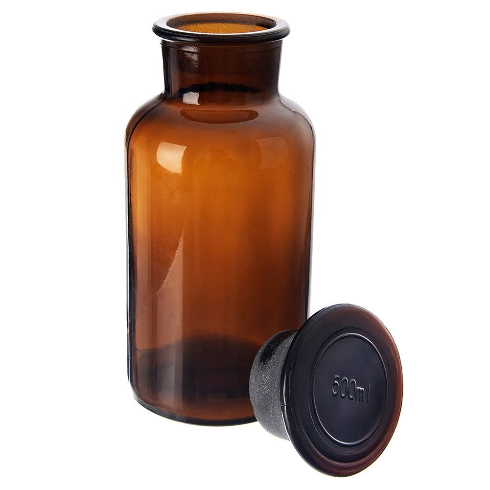 Una botella de vidrio marrón con un tapón oscuro separado que dice 500ml.