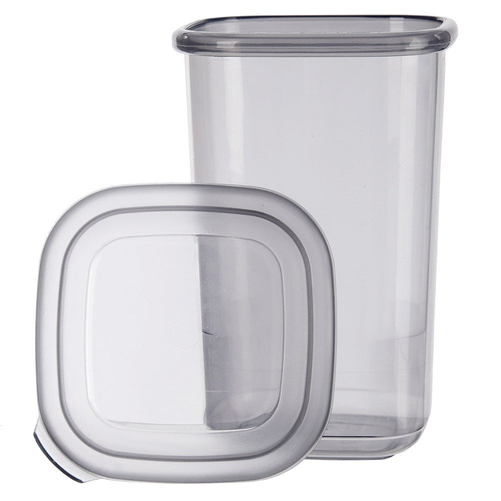 Un recipiente transparente con su tapa delante.