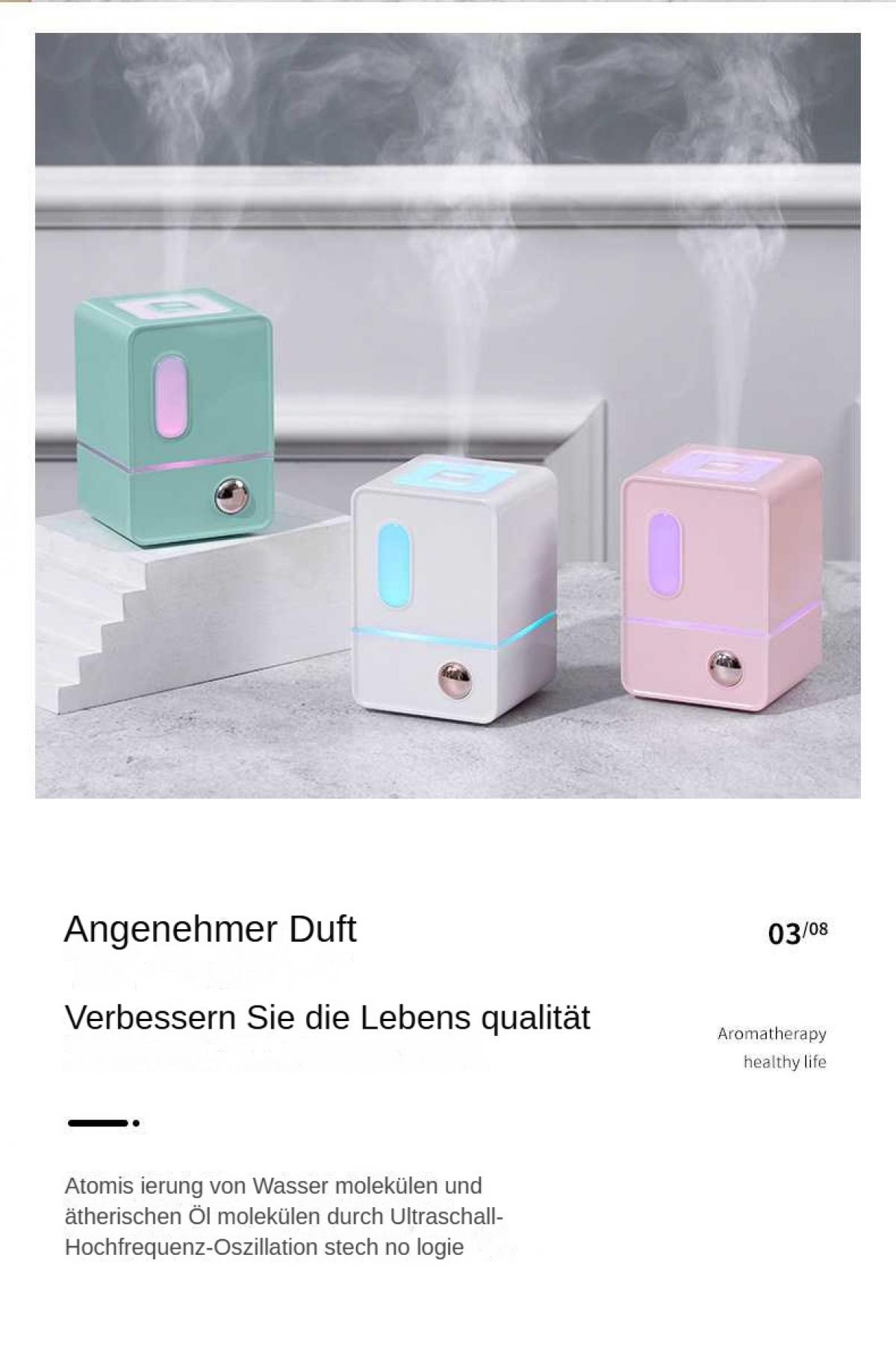 Drei würfelförmige Luftbefeuchter in Pastellfarben mit Nebel.