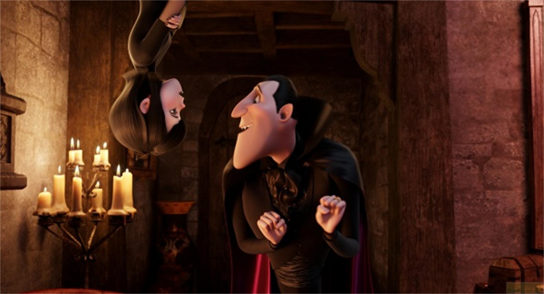 Une vampire pend à l'envers, faisant face à un vampire debout.