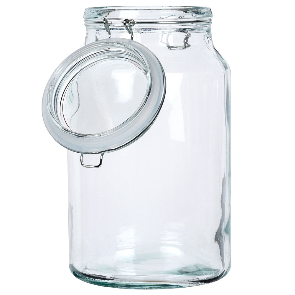 Un frasco de vidrio transparente con tapa abatible plateada, abierto.