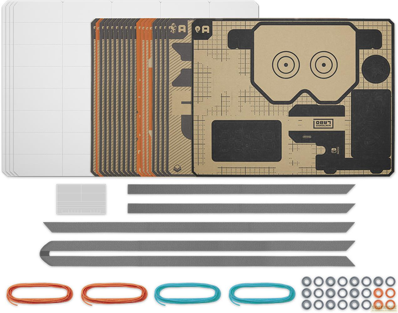 Zestawy Nintendo Labo z arkuszami kartonu, taśmą i sznurkami.