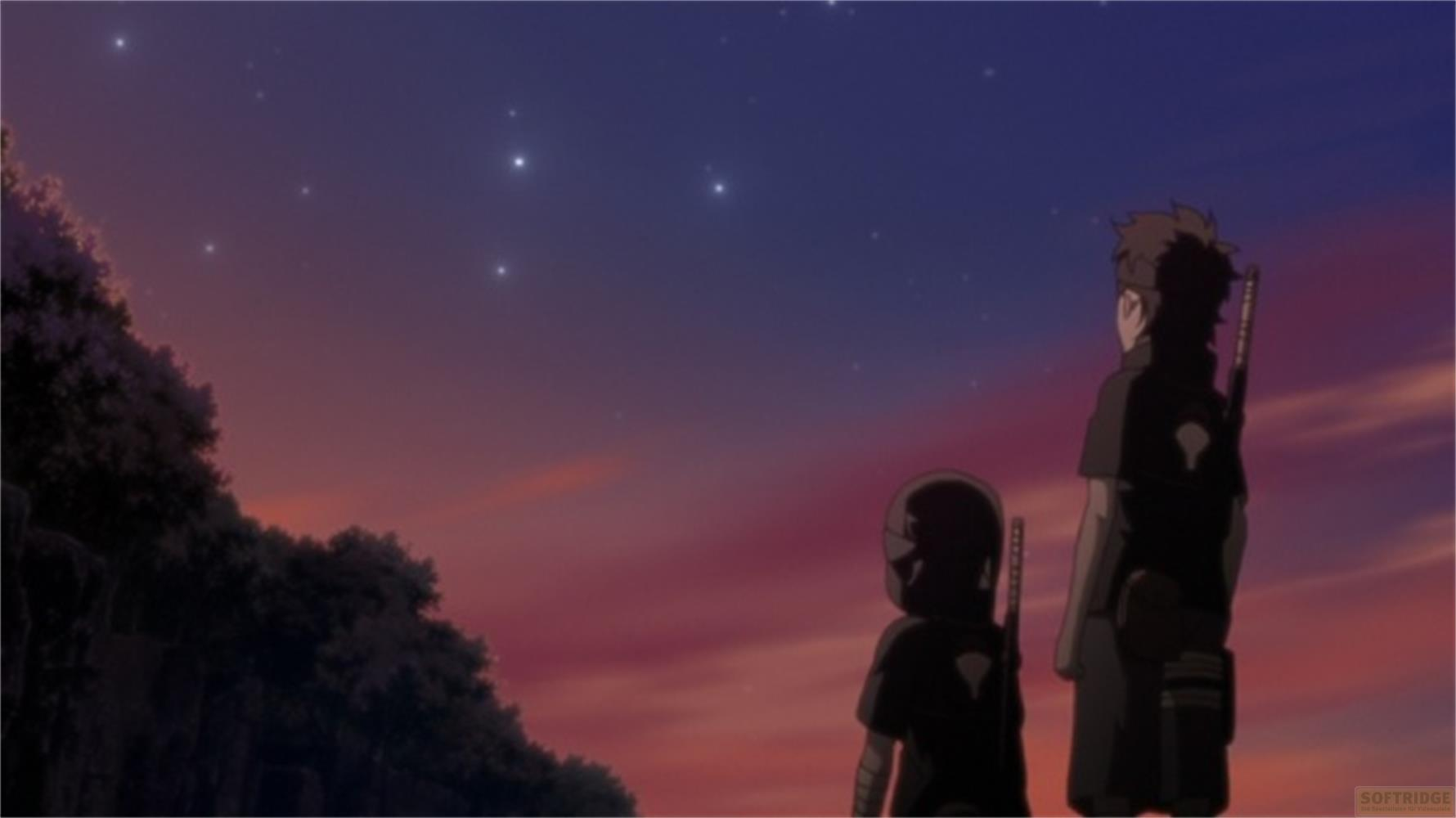 Due figure si stagliano contro un cielo crepuscolare stellato.