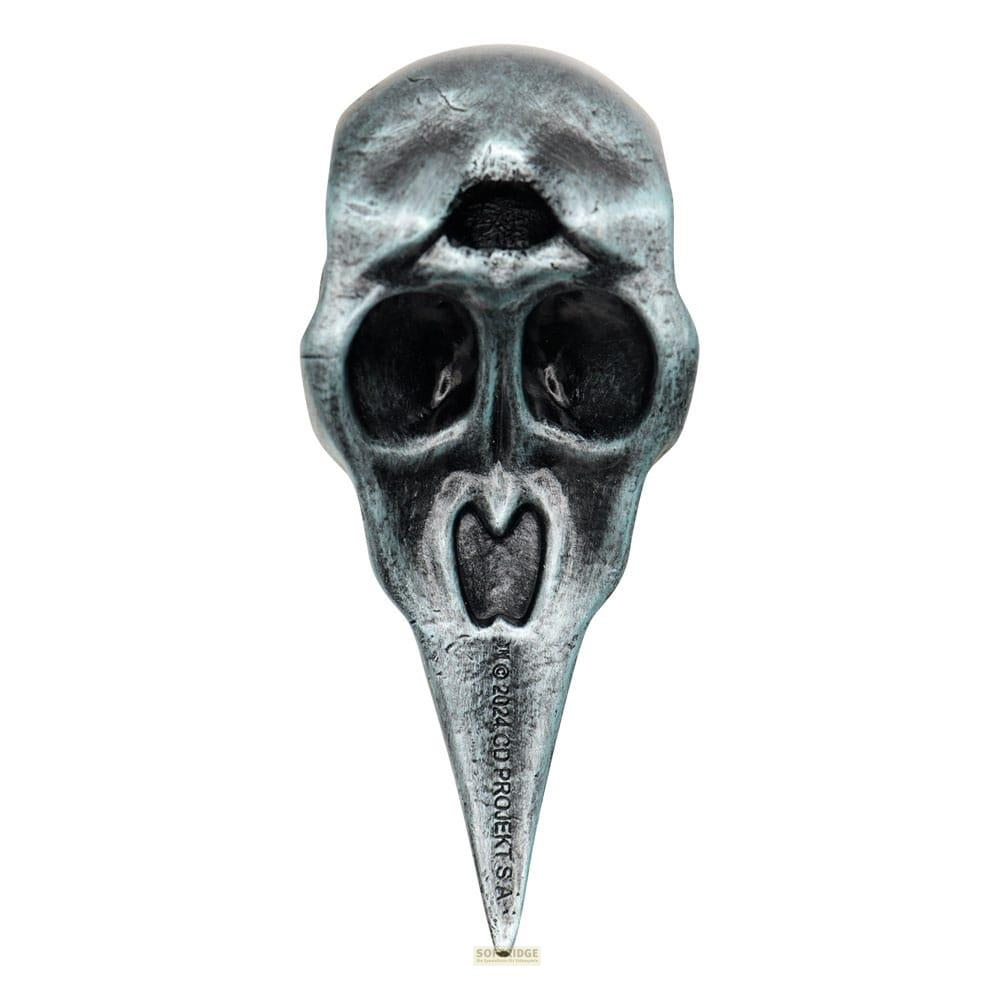 Abstrakte Totenkopfmaske mit drei Augen und schnabelartigem Kinn.