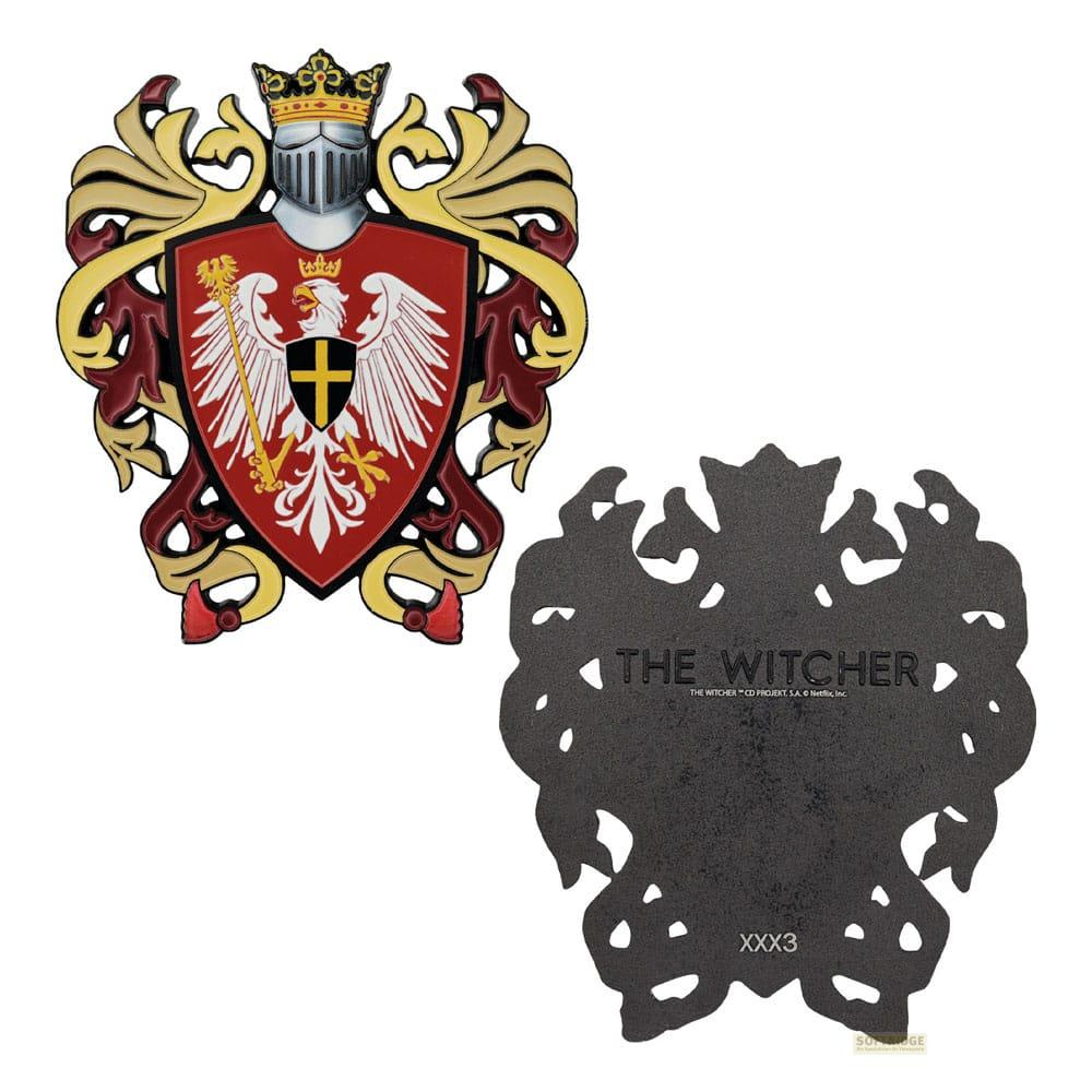Ein Wappen mit einem silbernen Adler, gekrönt, neben einem schwarzen Witcher-Symbol.