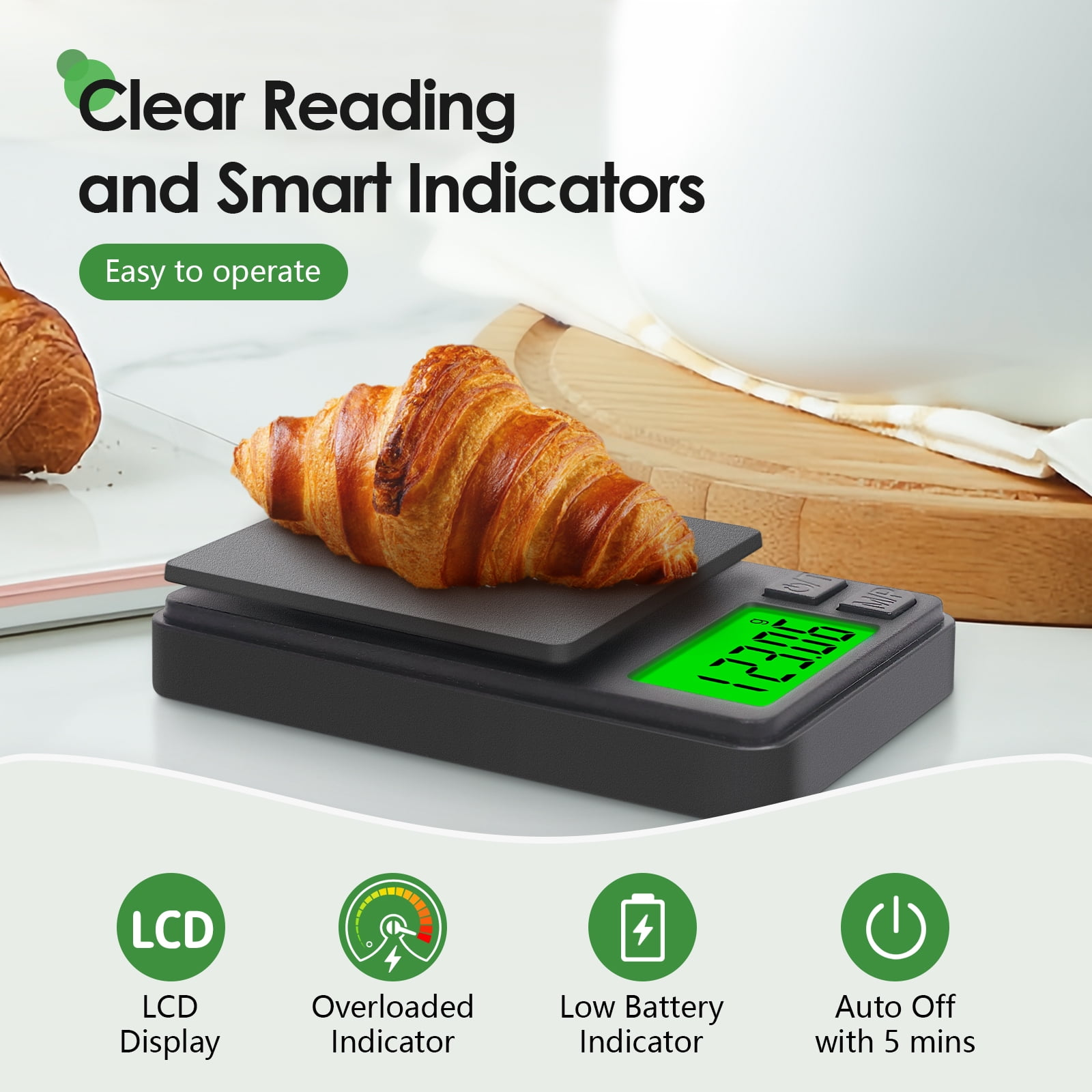 Eine digitale Küchenwaage mit einem Croissant, grüne LCD-Anzeige.