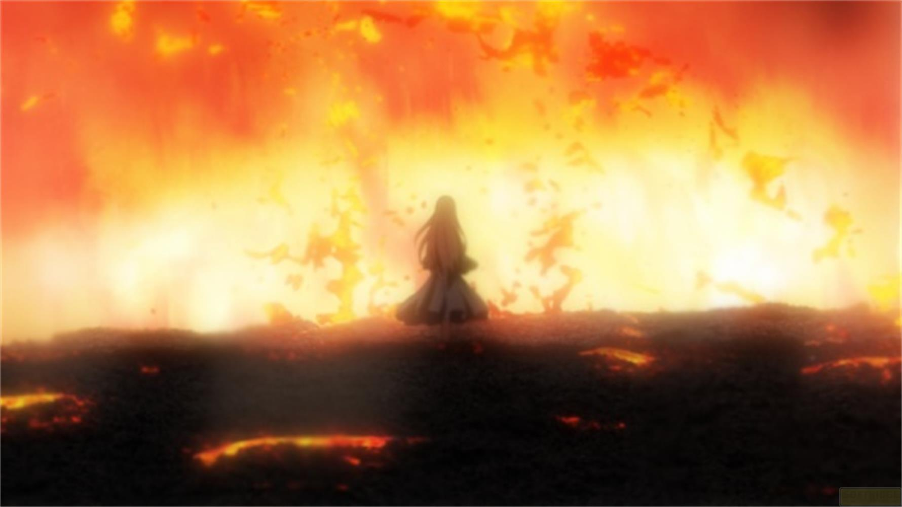 Una donna si trova davanti a un inferno di fuoco.