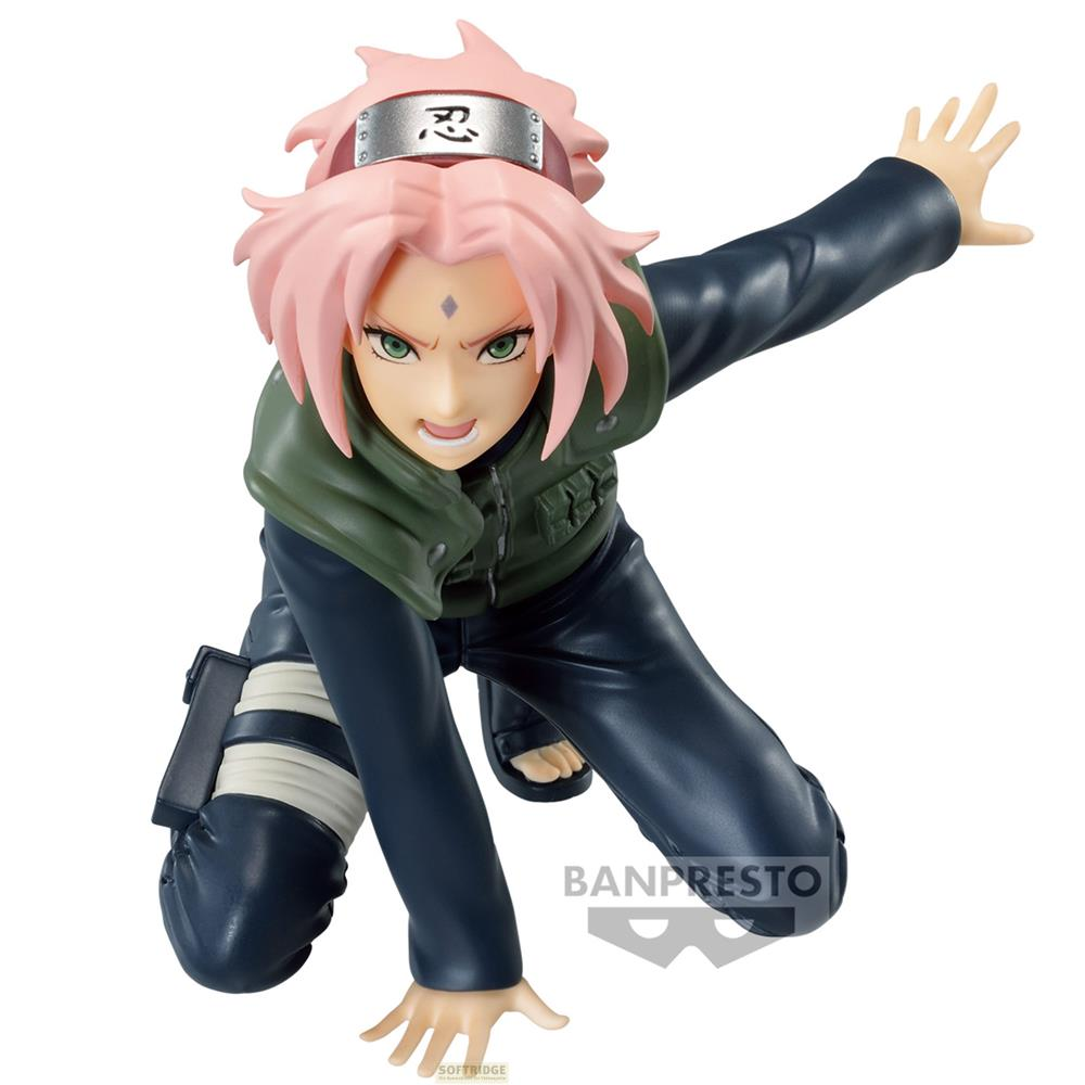 Sakura Figur in Aktion, mit pinkem Haar, grüner Weste und blauer Kleidung.