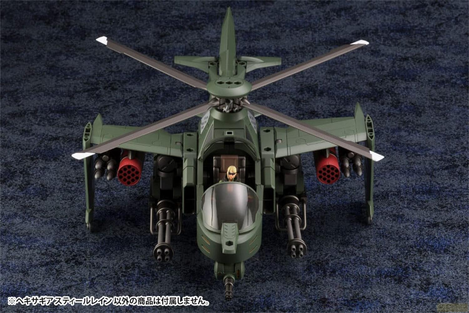 Grüner Kampfhubschrauber mit zwei Maschinengewehren und Raketenwerfern.