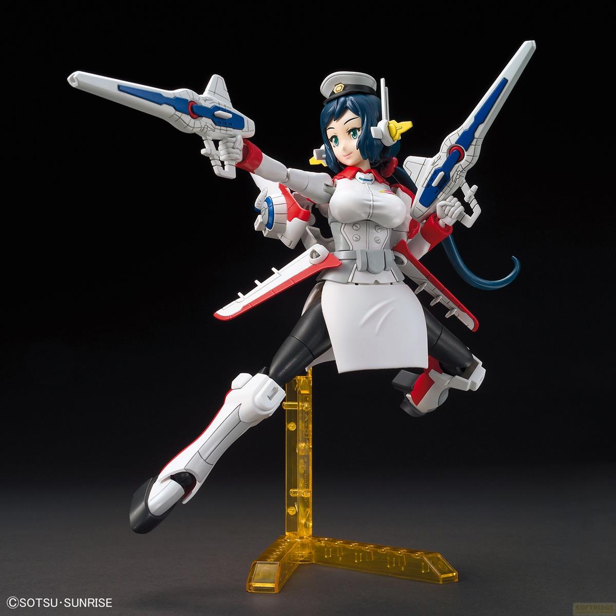 Figurine d'action féminine avec pistolets, tenue blanche et cheveux bleus sur un socle.