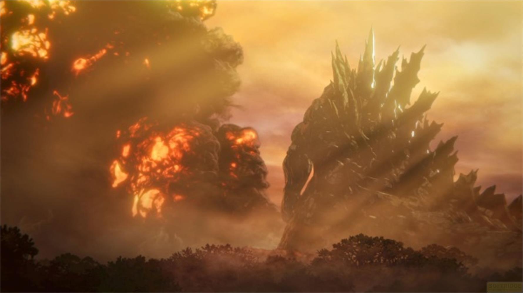 Godzilla e un'esplosione in un cielo arancione sopra gli alberi.