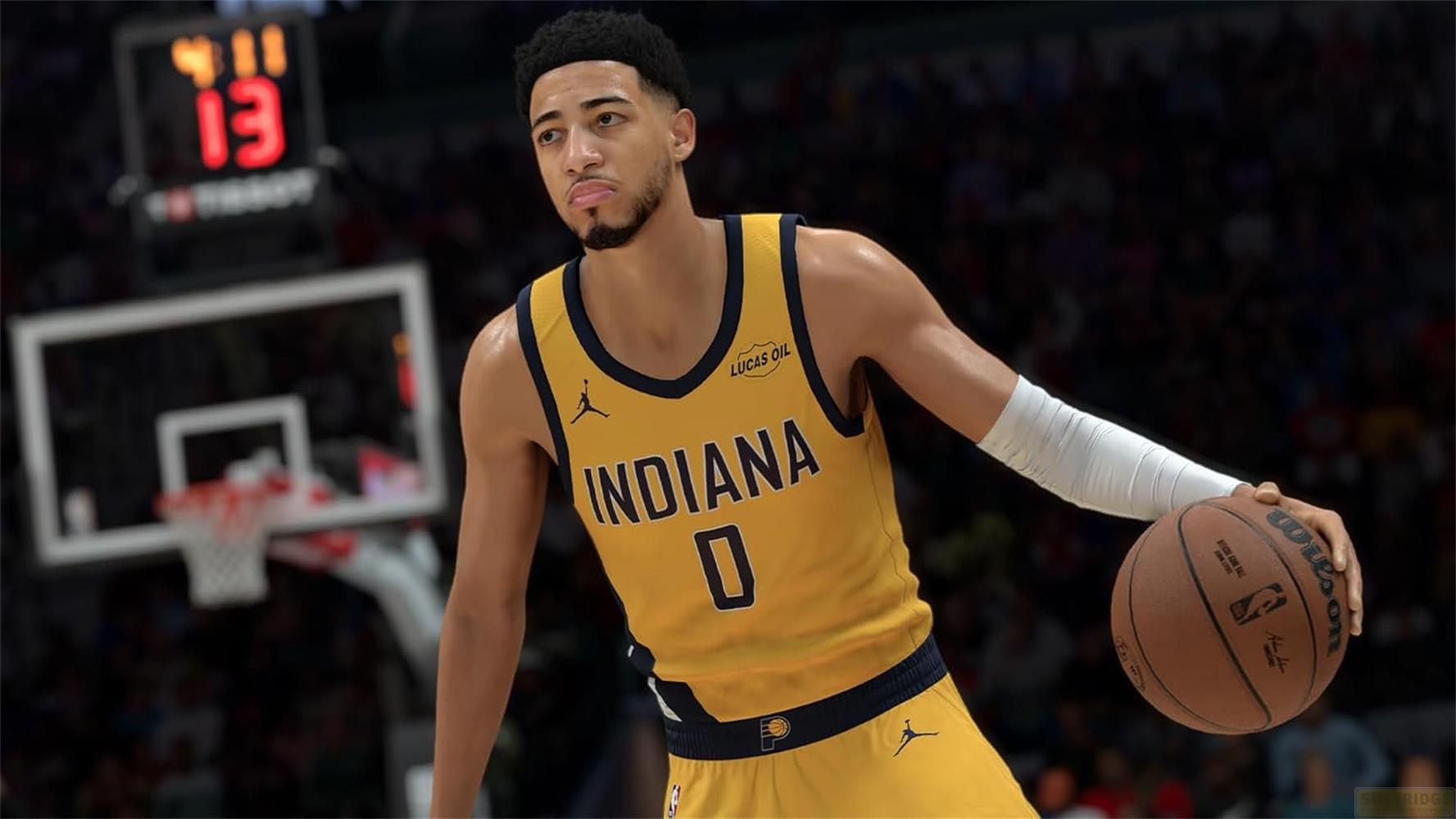 A basketball player in a yellow jersey with the number 0 plays.