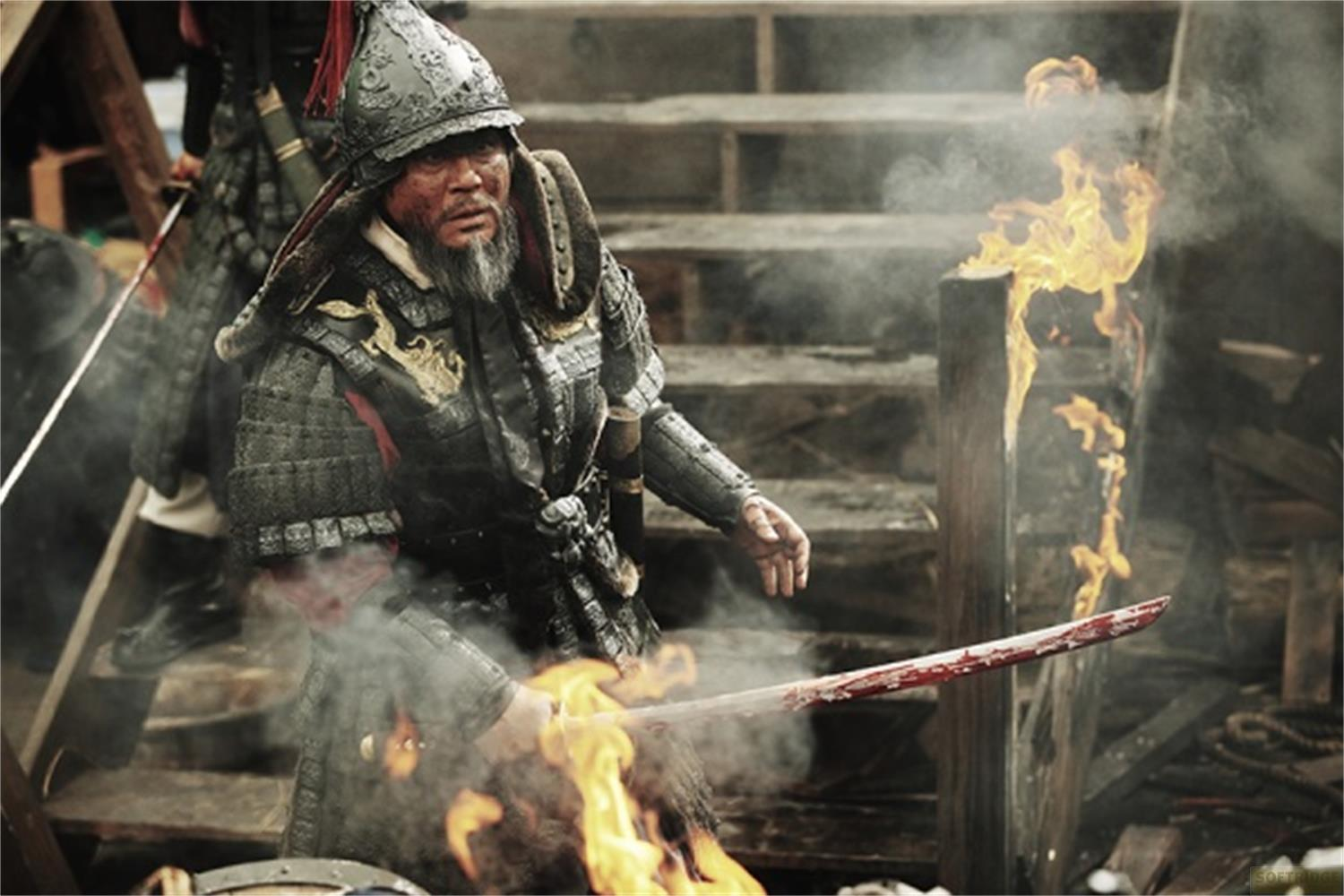 Un guerrier en armure tient une épée sanglante au milieu des flammes et de la fumée.