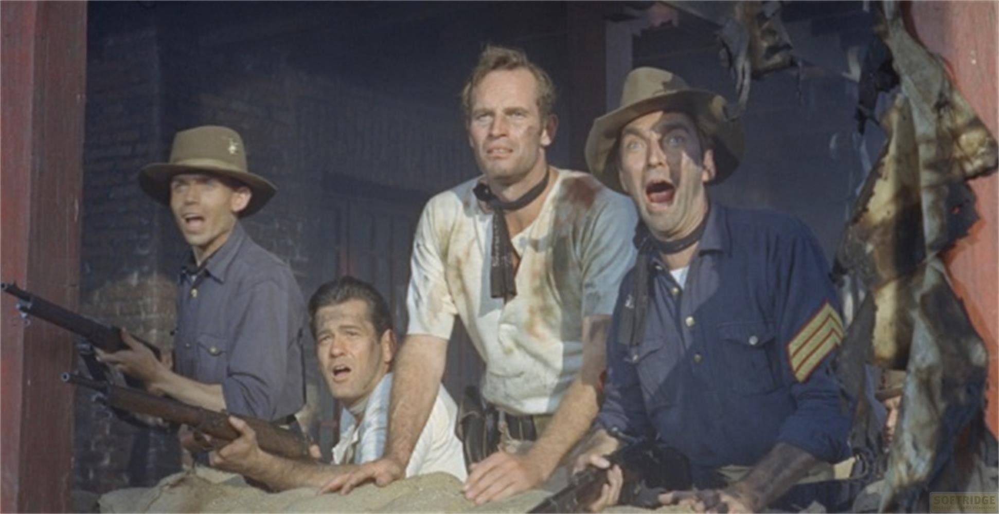 Quatre hommes en chapeau avec fusils, un homme crie de surprise.