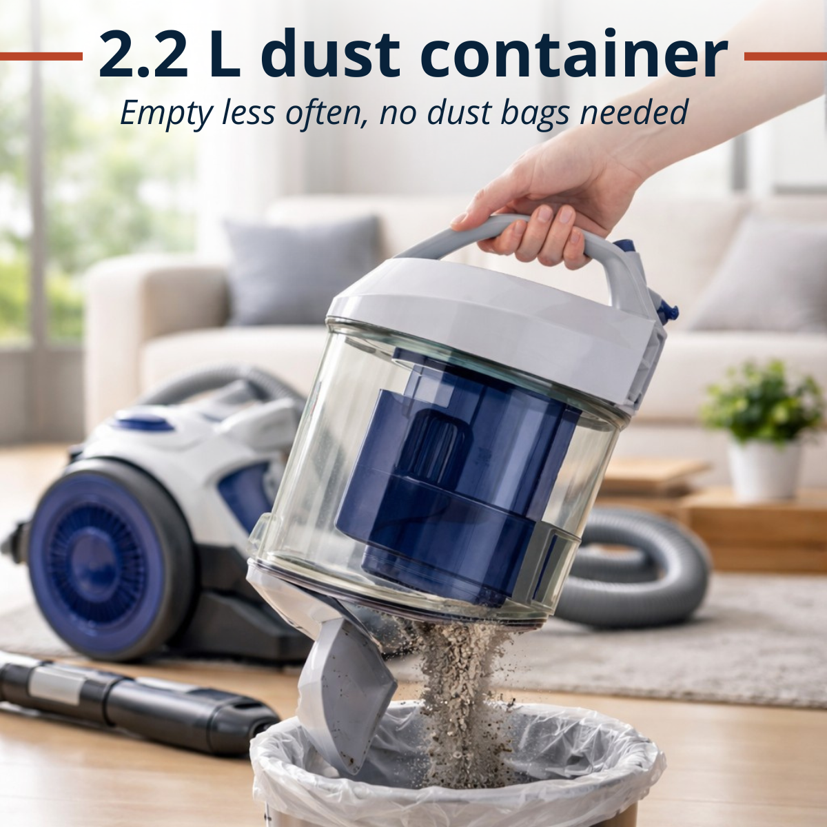 A hand empties a clear dust container from a vacuum cleaner into a trash bin.