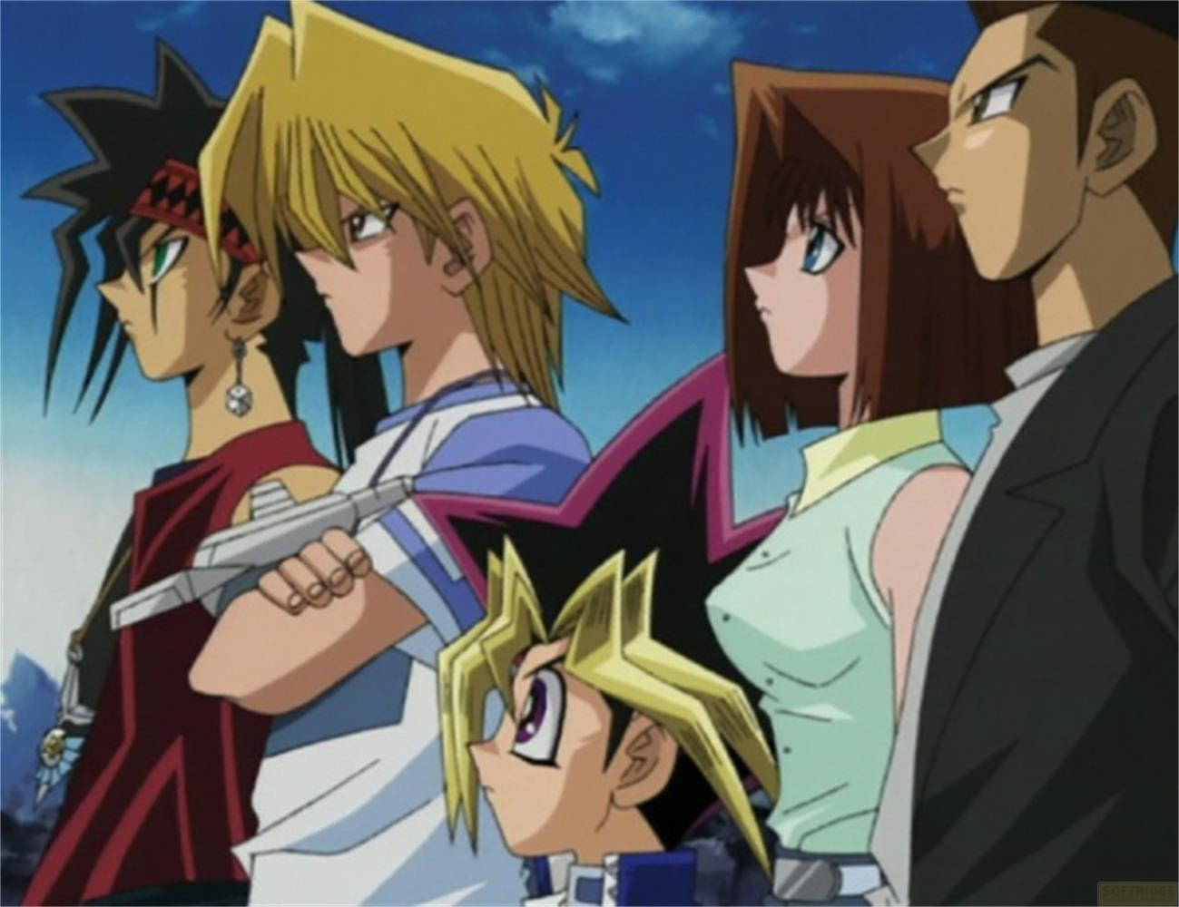 Cinque personaggi anime fianco a fianco, per lo più guardano a sinistra. Cielo blu sullo sfondo.