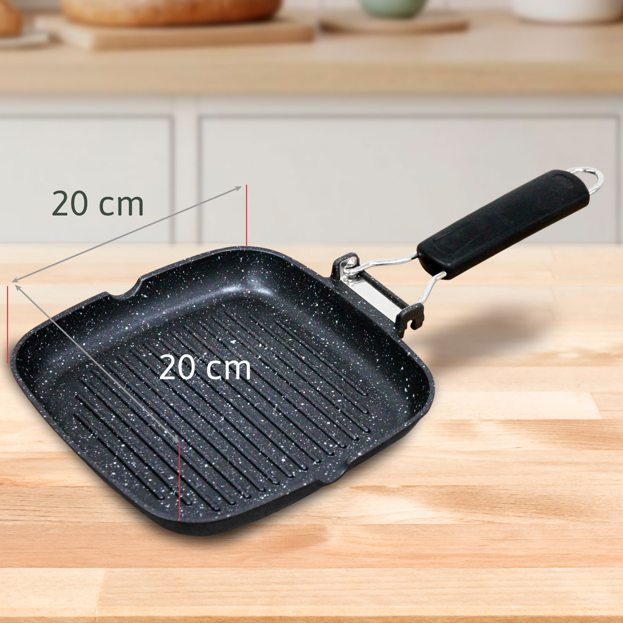 Una sartén grill negra de 20 cm con motas blancas y asa.