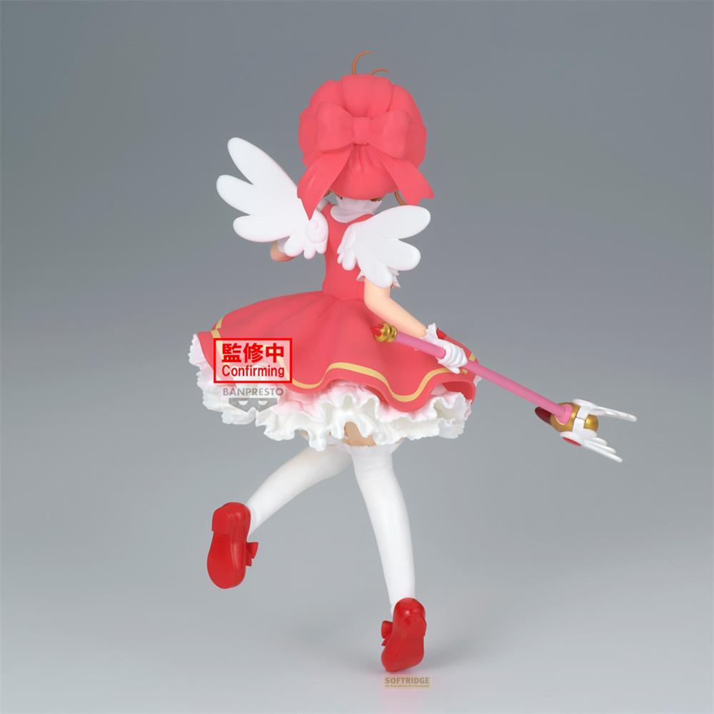 Figura de una niña con vestido rojo, alas y varita mágica.