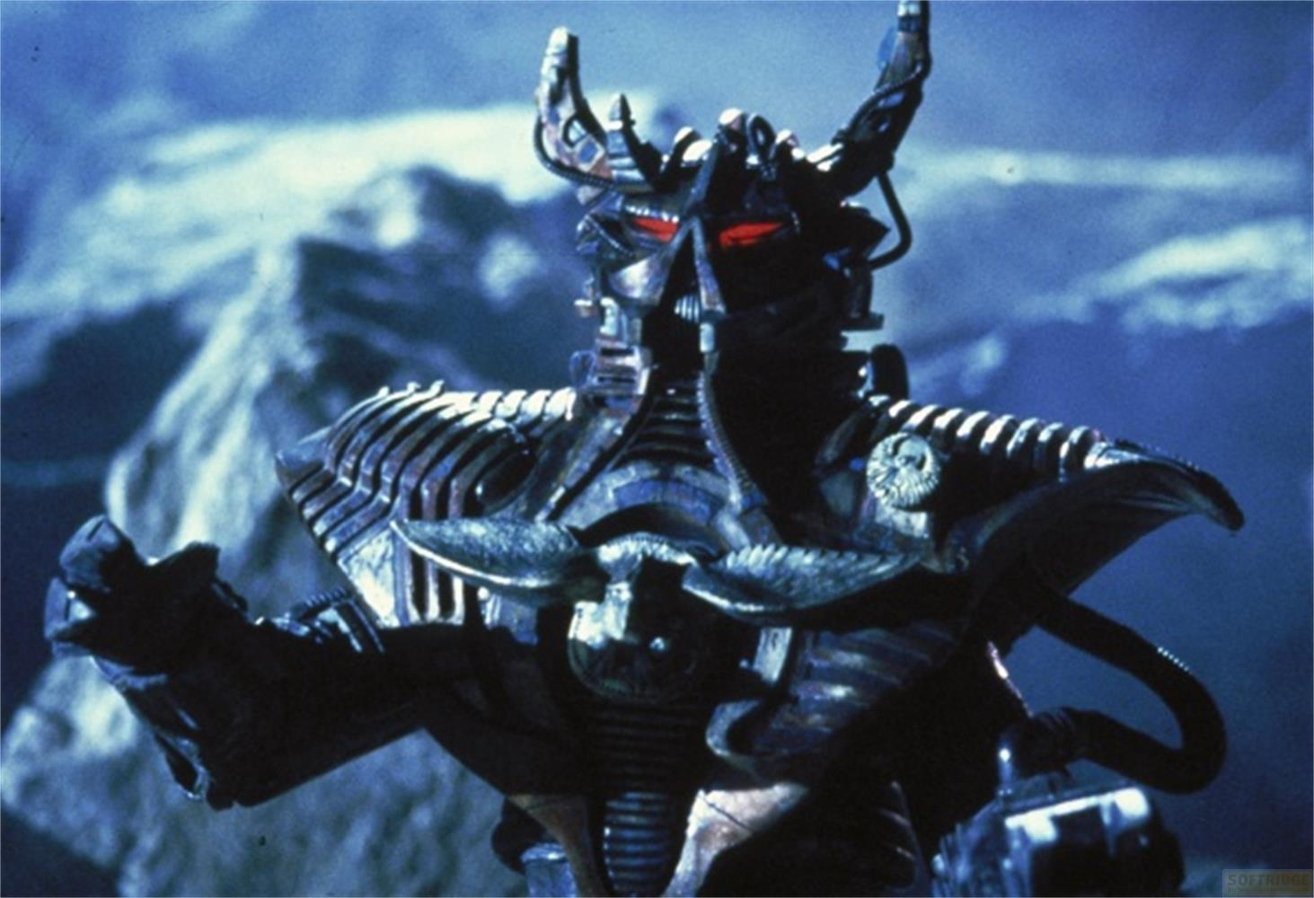 Un robot minaccioso con occhi rossi davanti a montagne ghiacciate.
