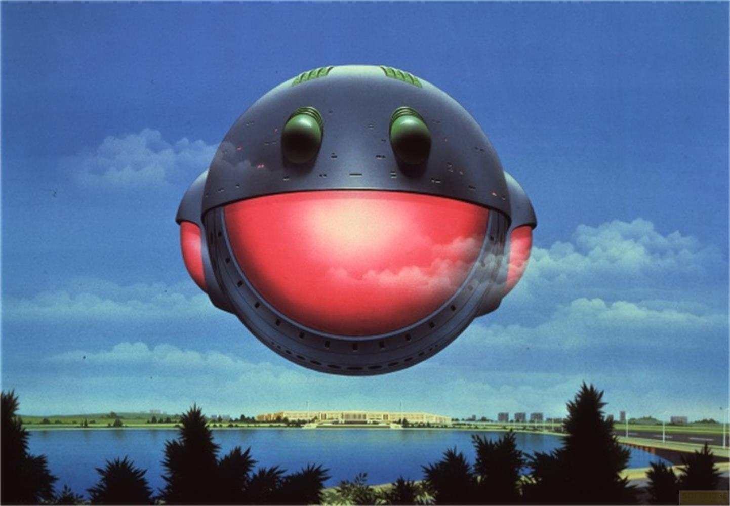 Un OVNI gris aux lumières rouges plane au-dessus d'un lac et d'une ville.