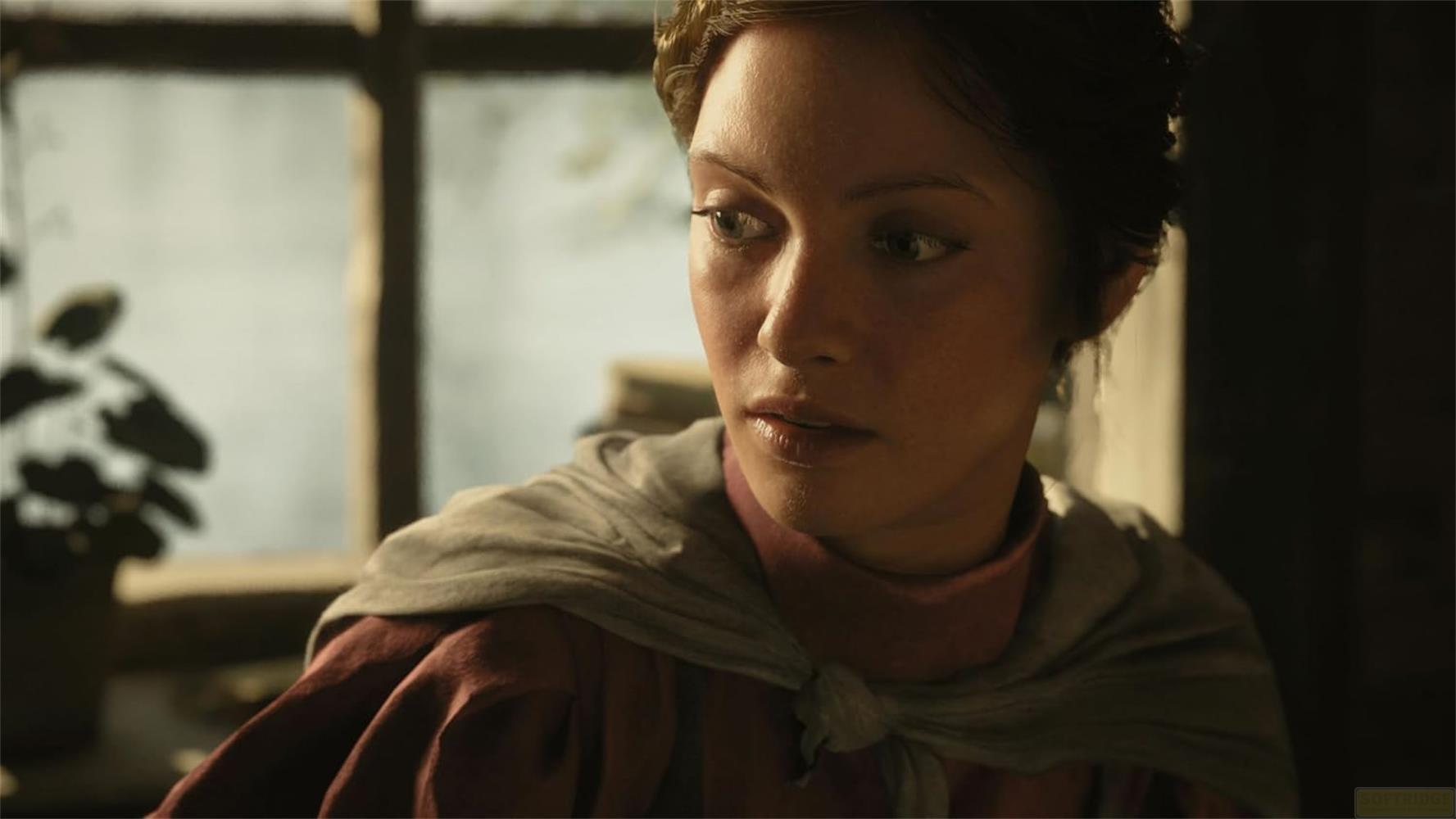 Una donna con i capelli castani indossa un vestito bordeaux e una sciarpa grigia. Guarda a destra.