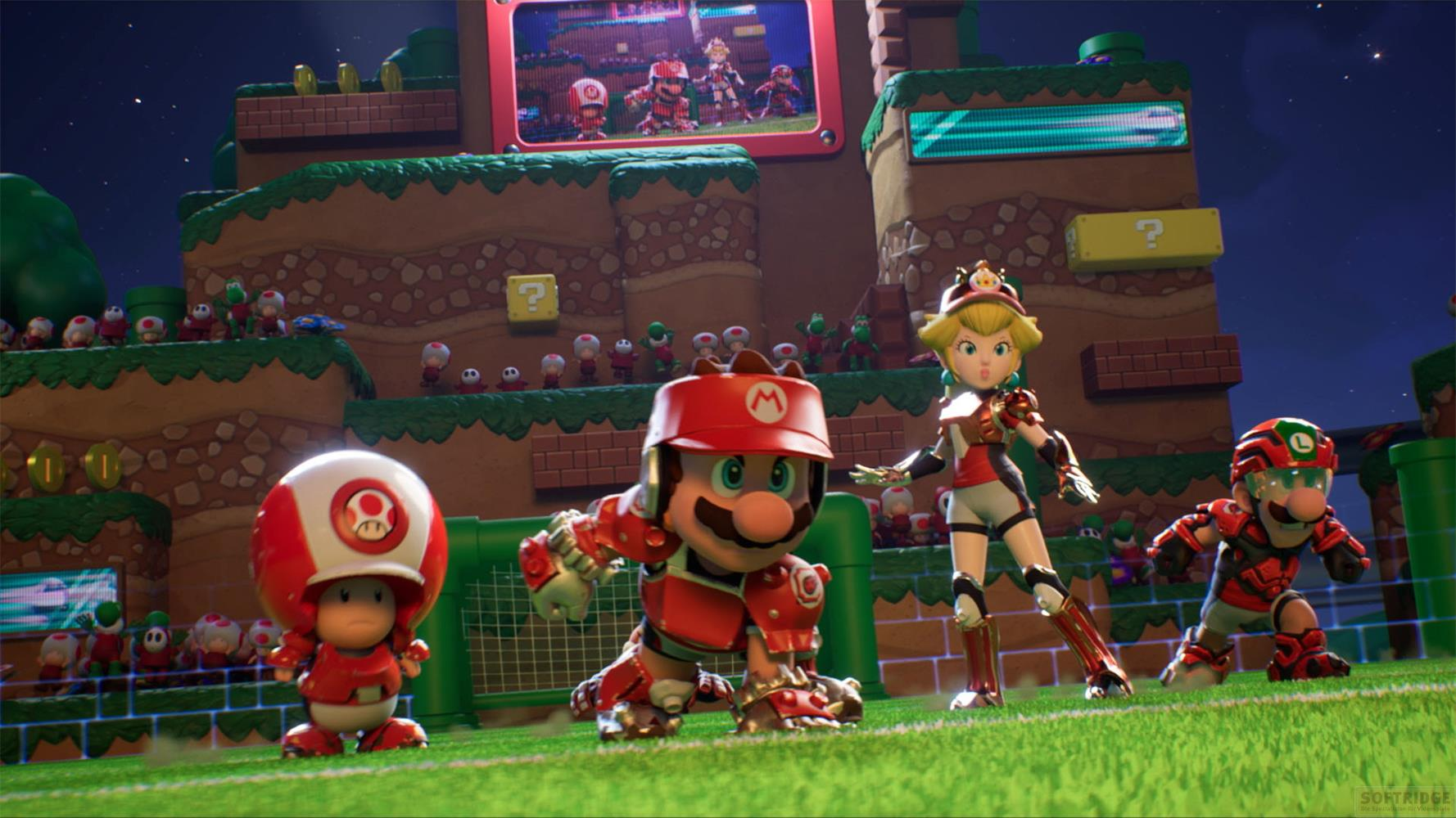 Personaggi di Mario in armatura rossa su un campo da calcio con terreno a gradoni e cielo stellato.