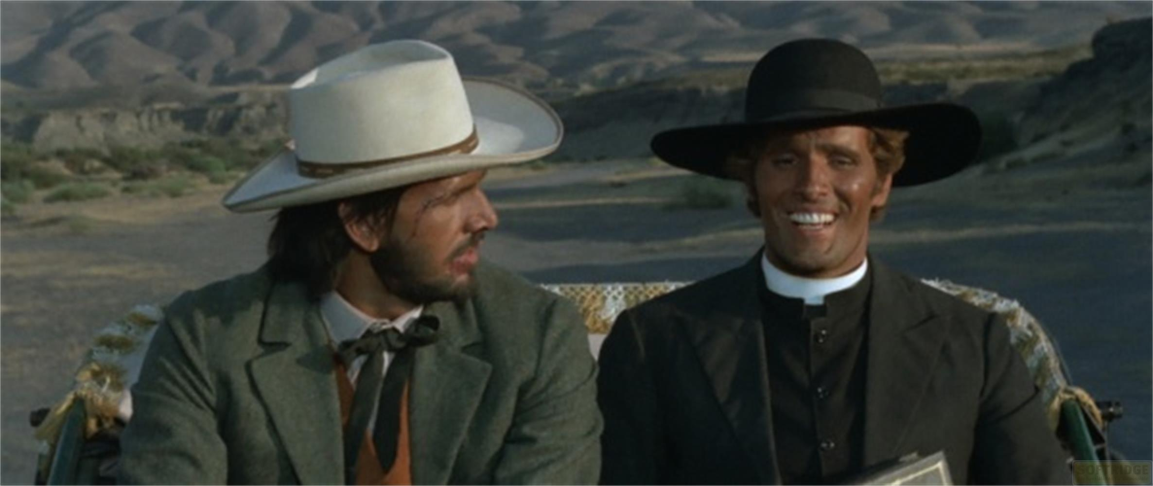 Due uomini in carrozza, uno con cappello bianco, l'altro con cappello nero e colletto da prete.