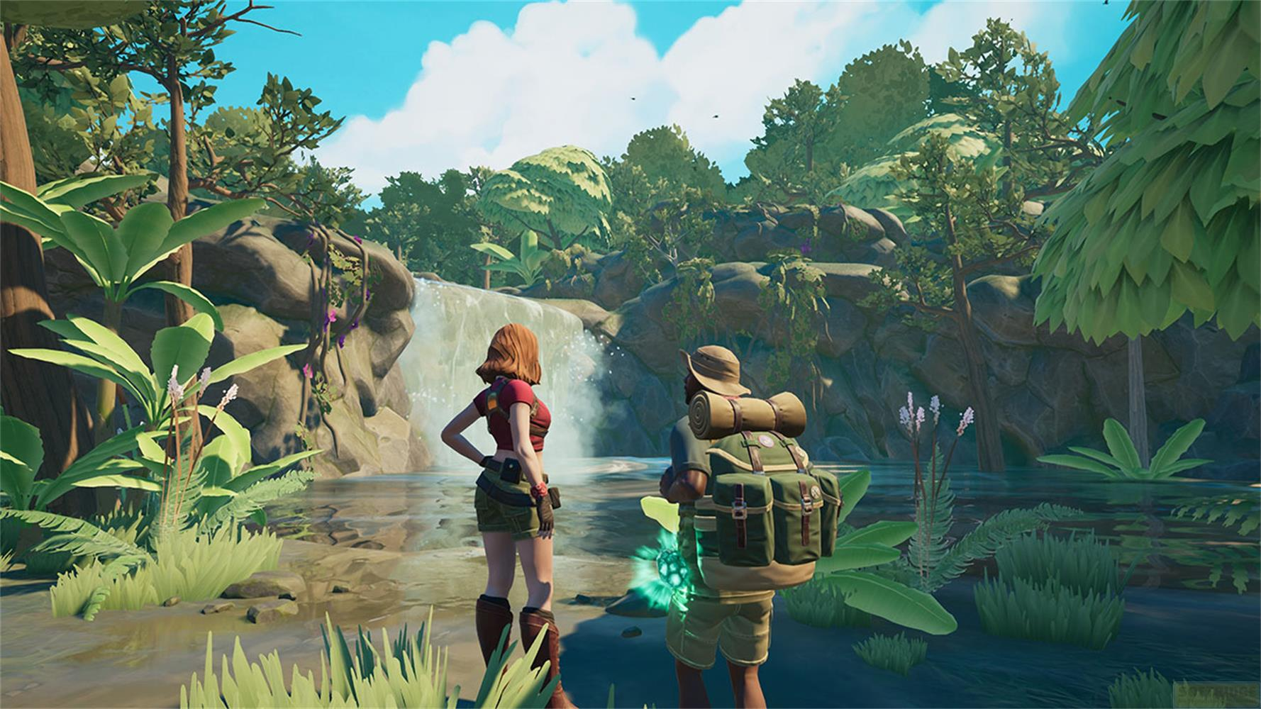 Deux aventuriers se tiennent devant une cascade dans une jungle luxuriante.