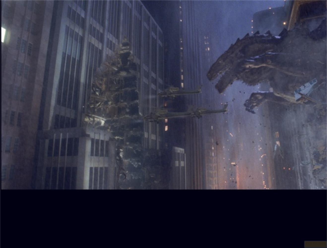 Un monstre géant attaque une ville pendant que des avions volent.
