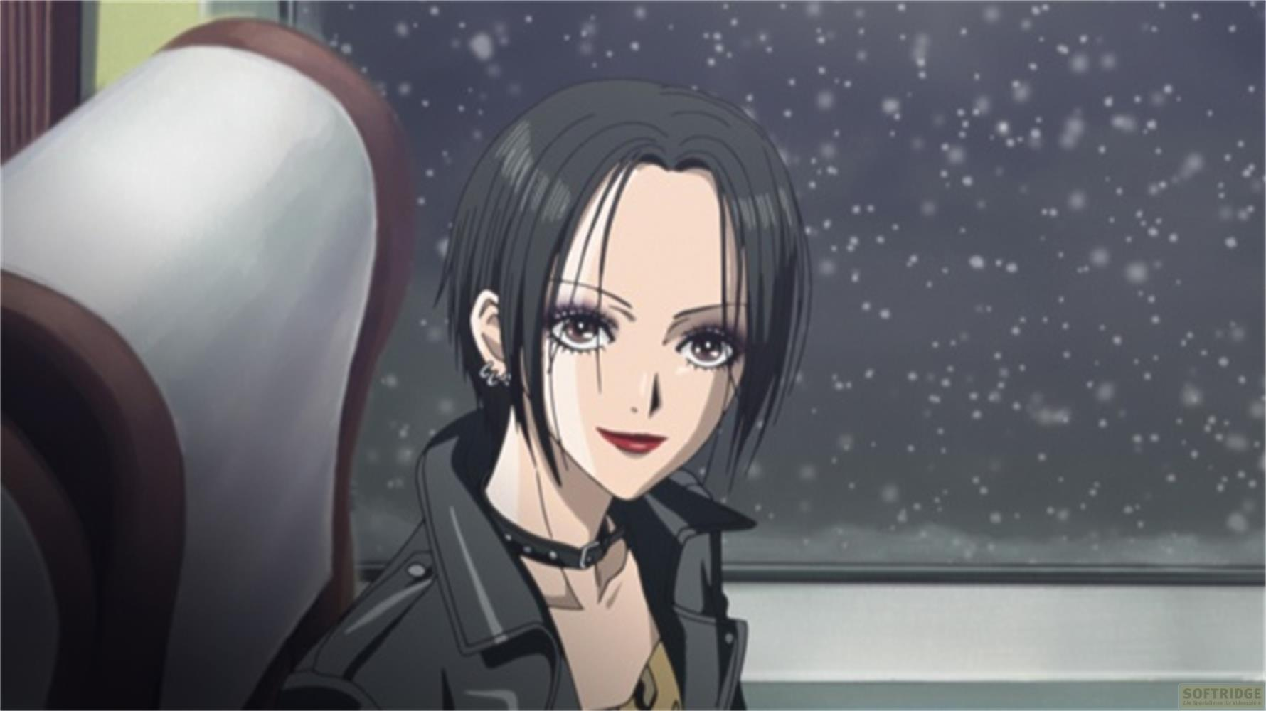 Ragazza anime con capelli neri, giacca di pelle e gioielli, nella neve.