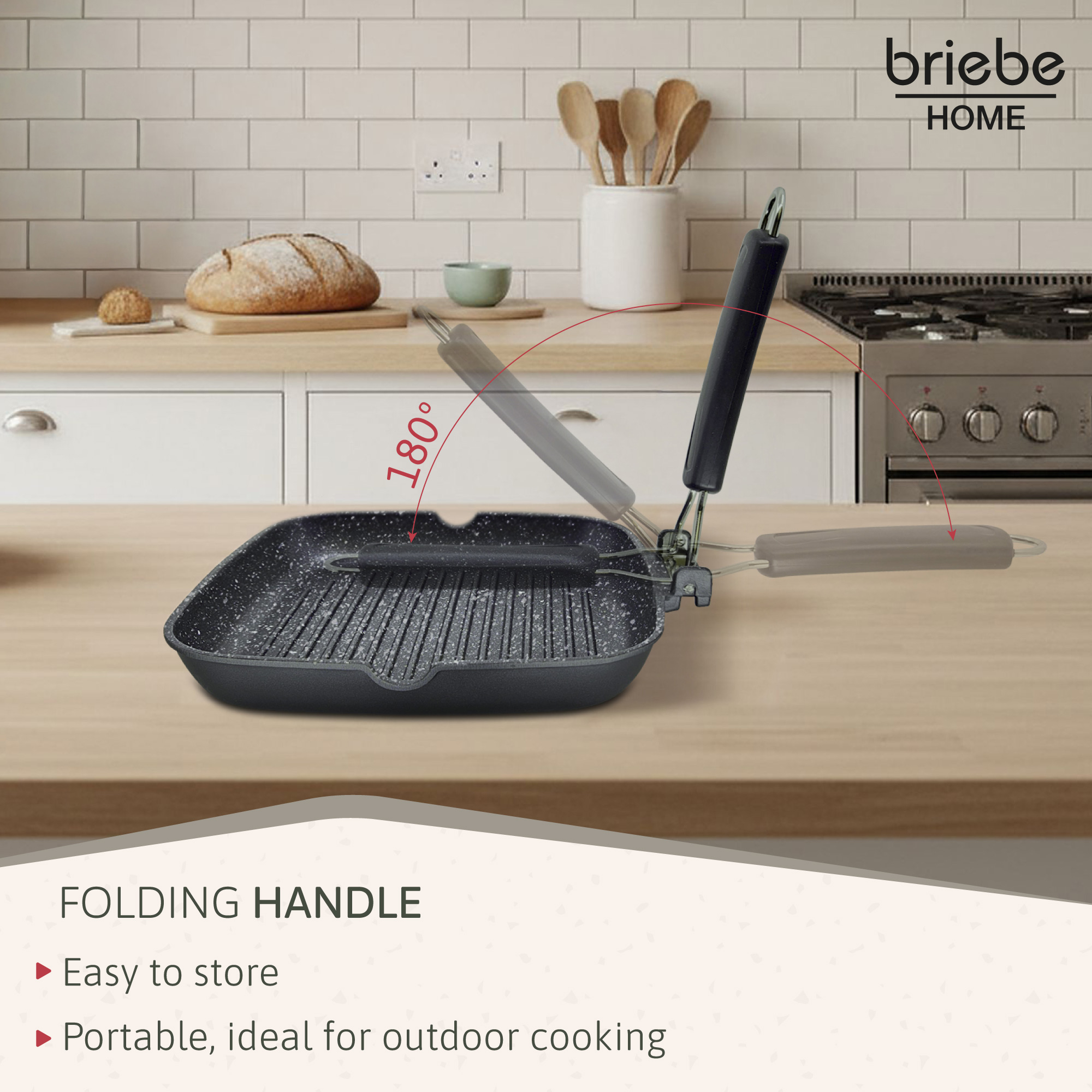 Una sartén grill negra con asa plegable sobre una superficie de madera.