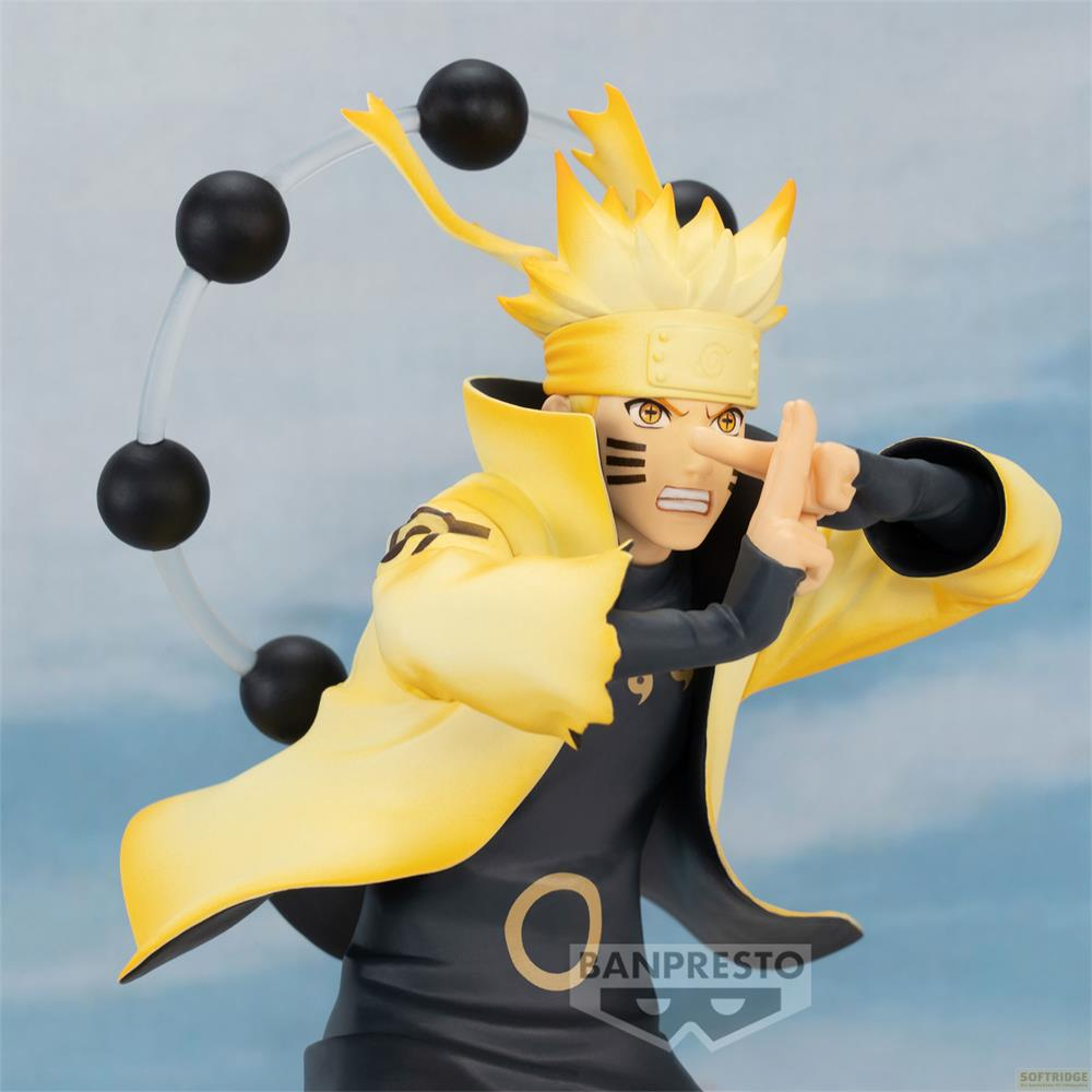 Figura de Naruto con túnica amarilla y orbes negros detrás.