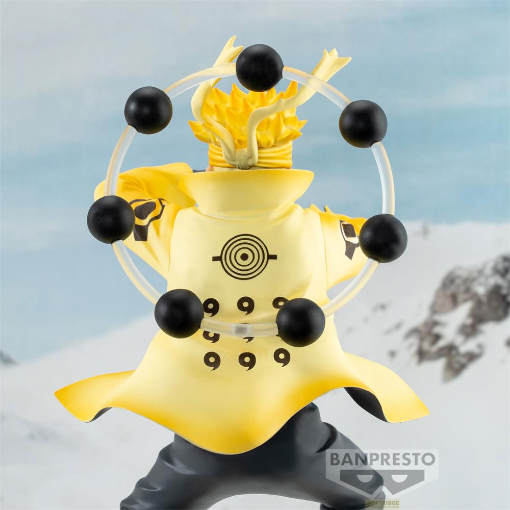 Figura de Naruto con túnica amarilla, orbes negros y un anillo en la nieve.