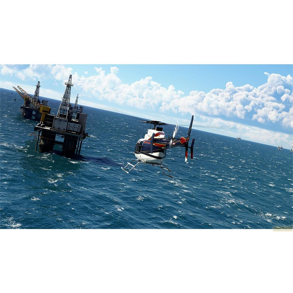 Un elicottero vola sul mare verso una piattaforma petrolifera.