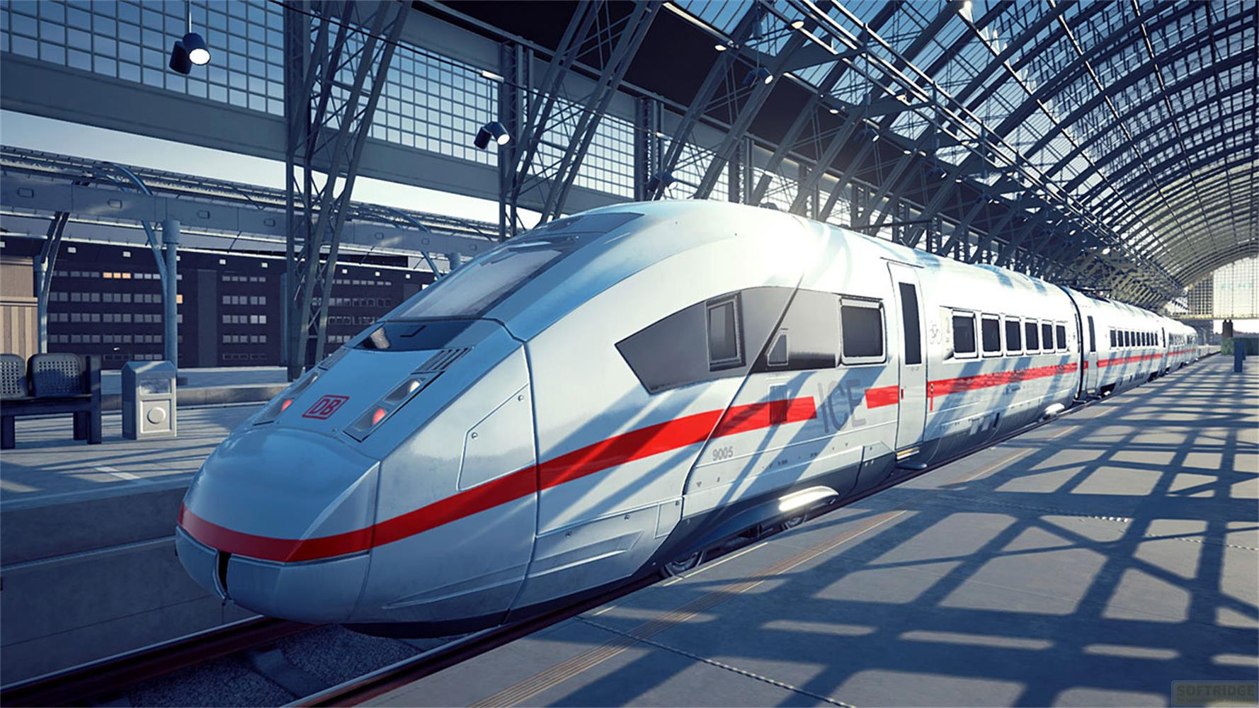 Ein weißer ICE-Zug mit roten Streifen steht auf Gleisen in einer Bahnhofshalle.