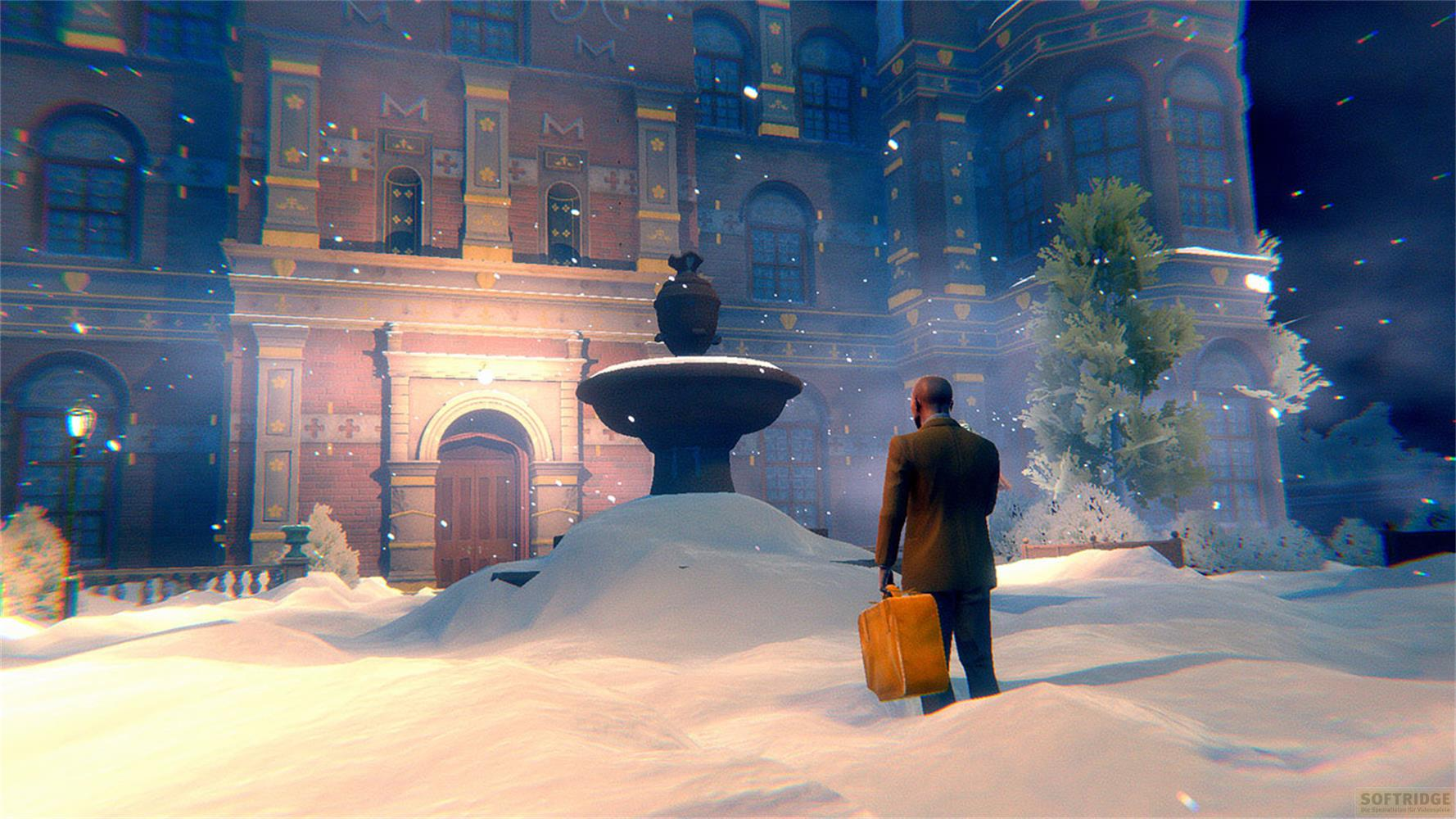Un uomo con una valigia è in piedi sulla neve davanti a un edificio con fontana.