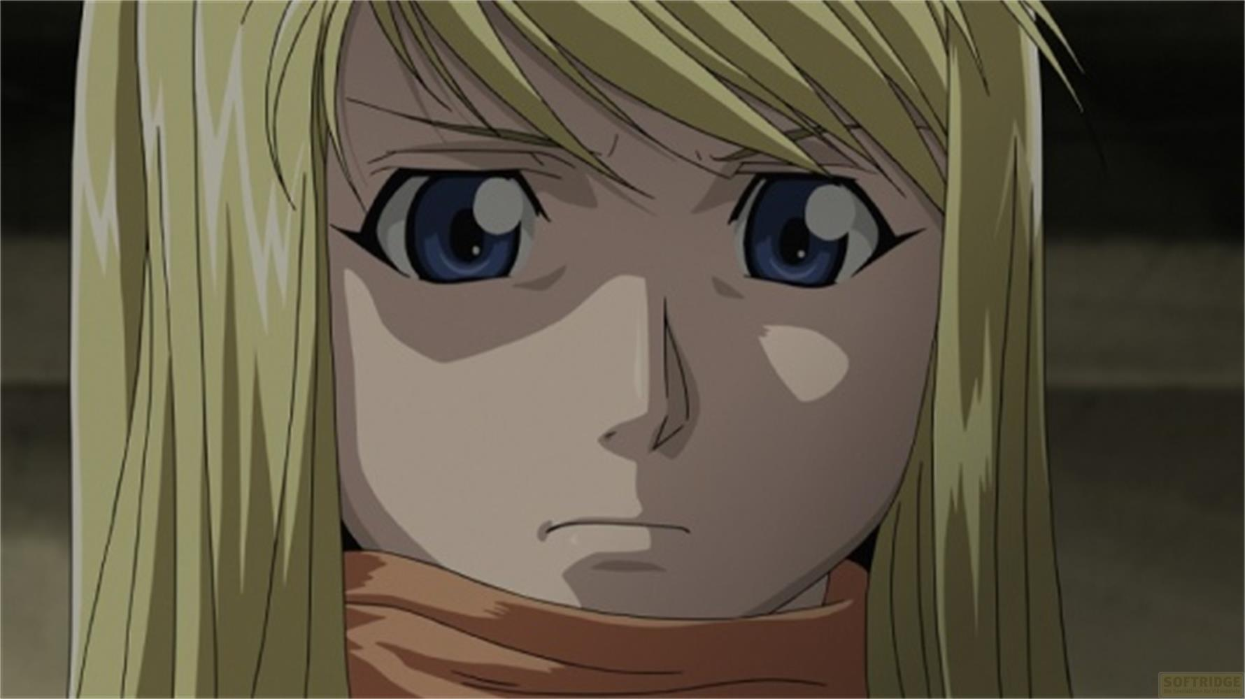 Primo piano di una ragazza anime bionda con occhi blu e sciarpa arancione.
