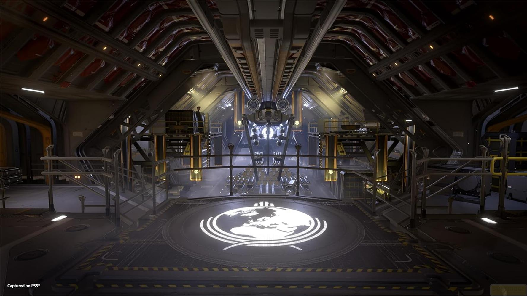 Een futuristische hangar met een wereldbol-insigne op de vloer.