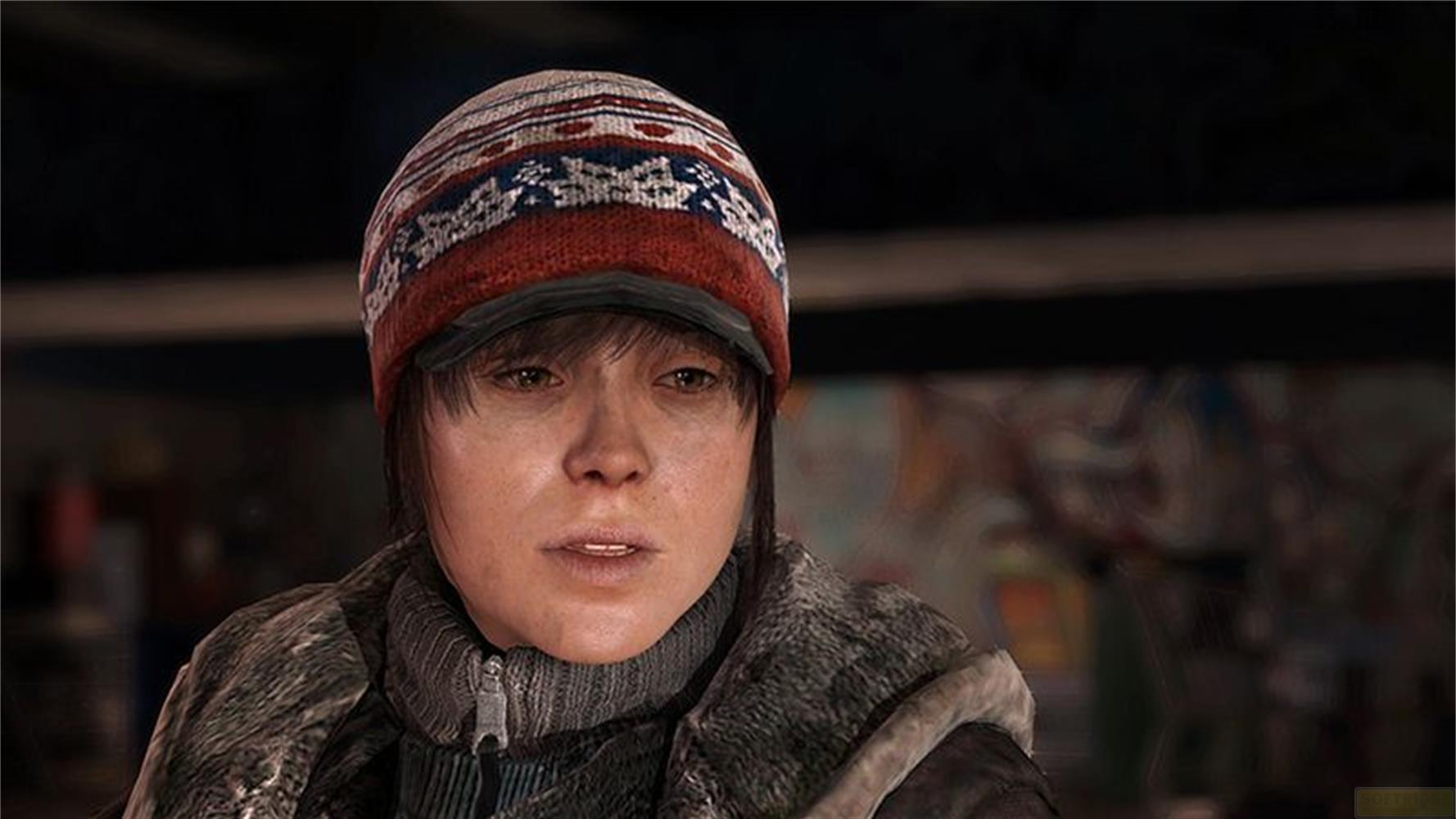 Une jeune femme portant un bonnet rayé et une veste d'hiver.