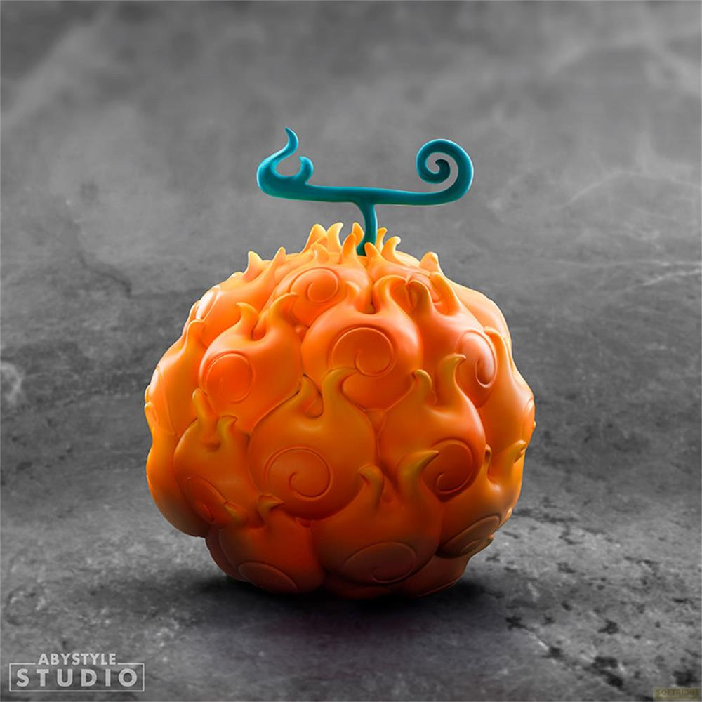 Eine orangefarbene, flammenförmige Frucht mit einem blauen Stiel und Spiralen.