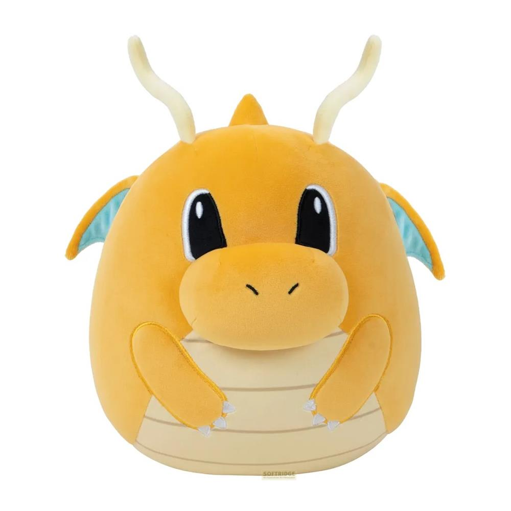 Un dragon en peluche rond et jaune avec des ailes et des cornes bleues.